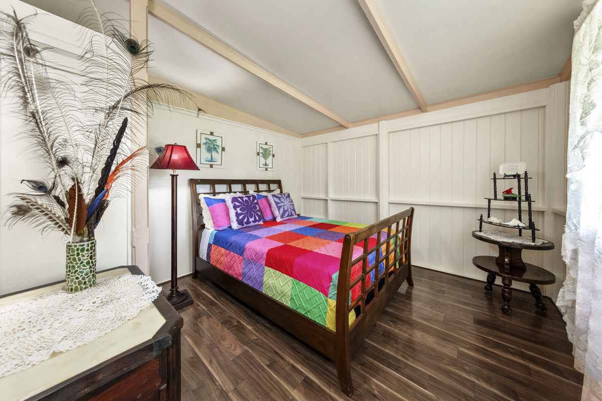 11-3545 Pikake Street Mountain View, HI 96771 - Photo 10 of 30 a bedroom with a bed and a dresser