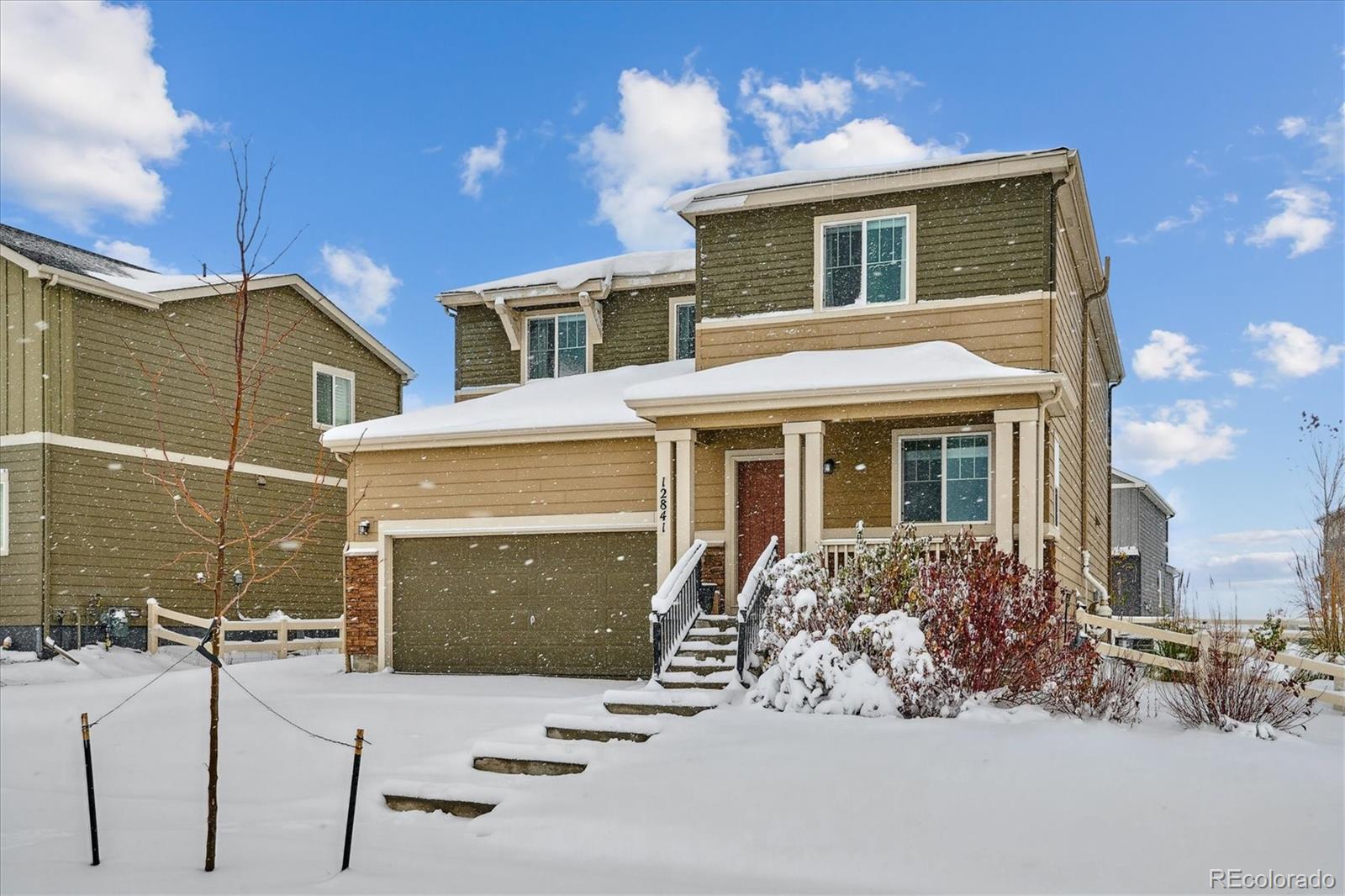 12841 Red Rosa Circle Parker, CO 80134 - Photo 1 of 29 a front view of a house with a yard