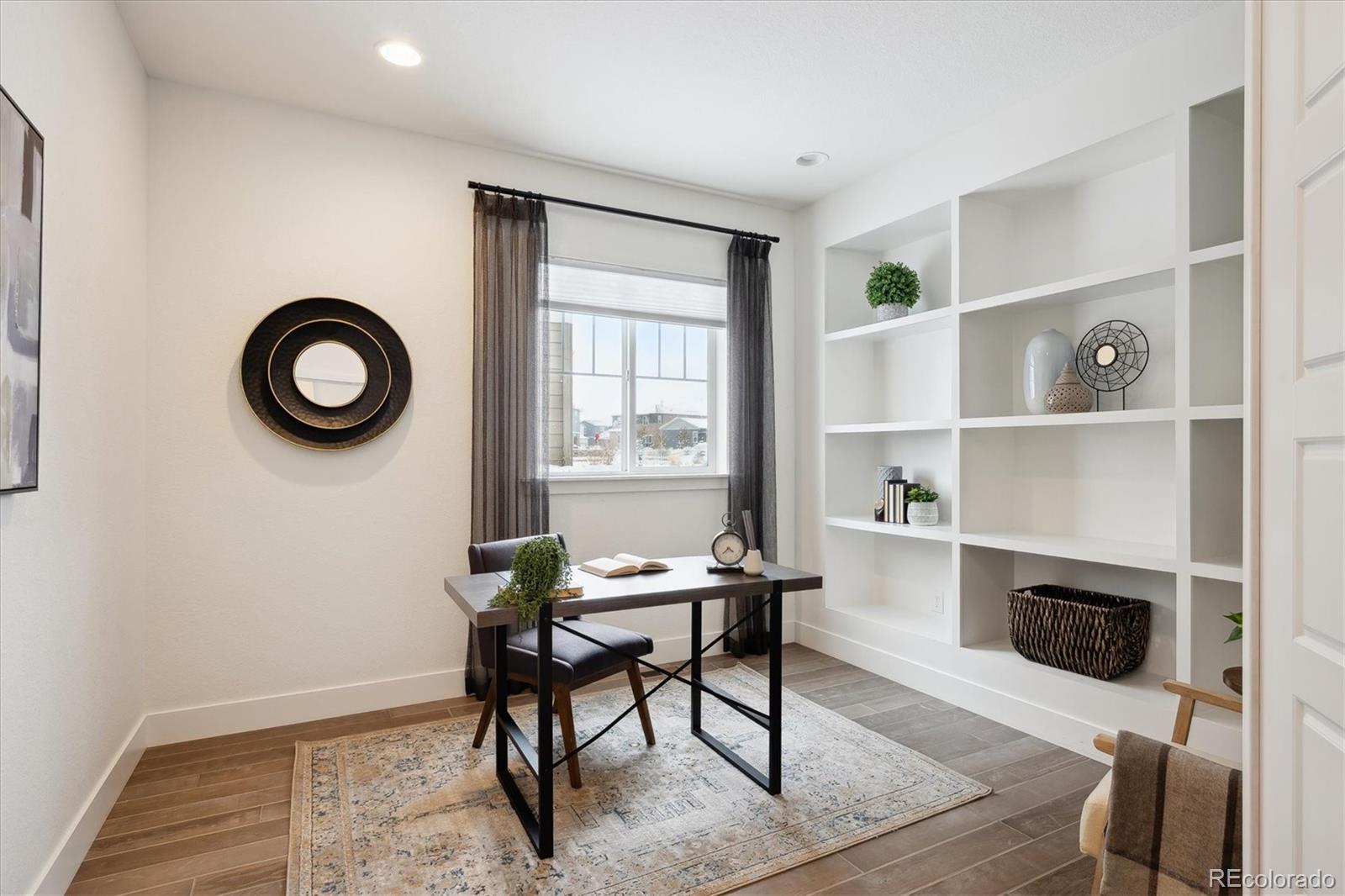 12841 Red Rosa Circle Parker, CO 80134 - Photo 11 of 29 a workspace with furniture and a fireplace