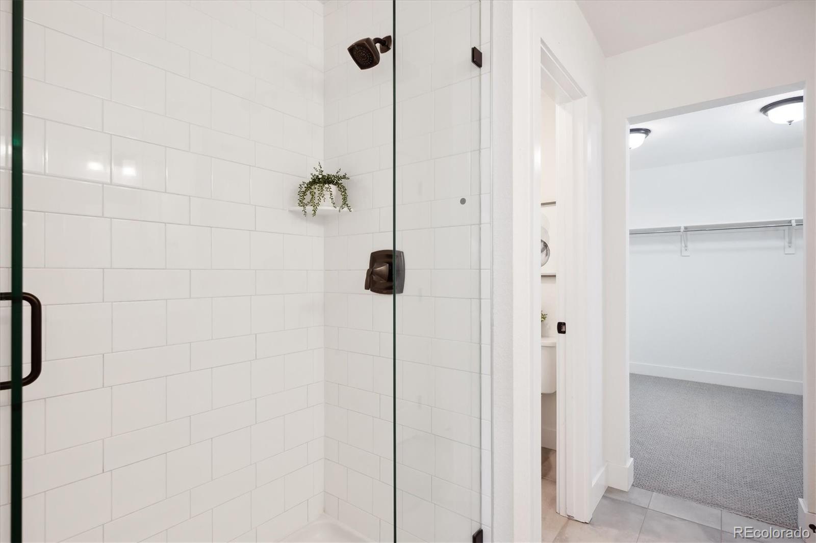 12841 Red Rosa Circle Parker, CO 80134 - Photo 17 of 29 a bathroom with a shower