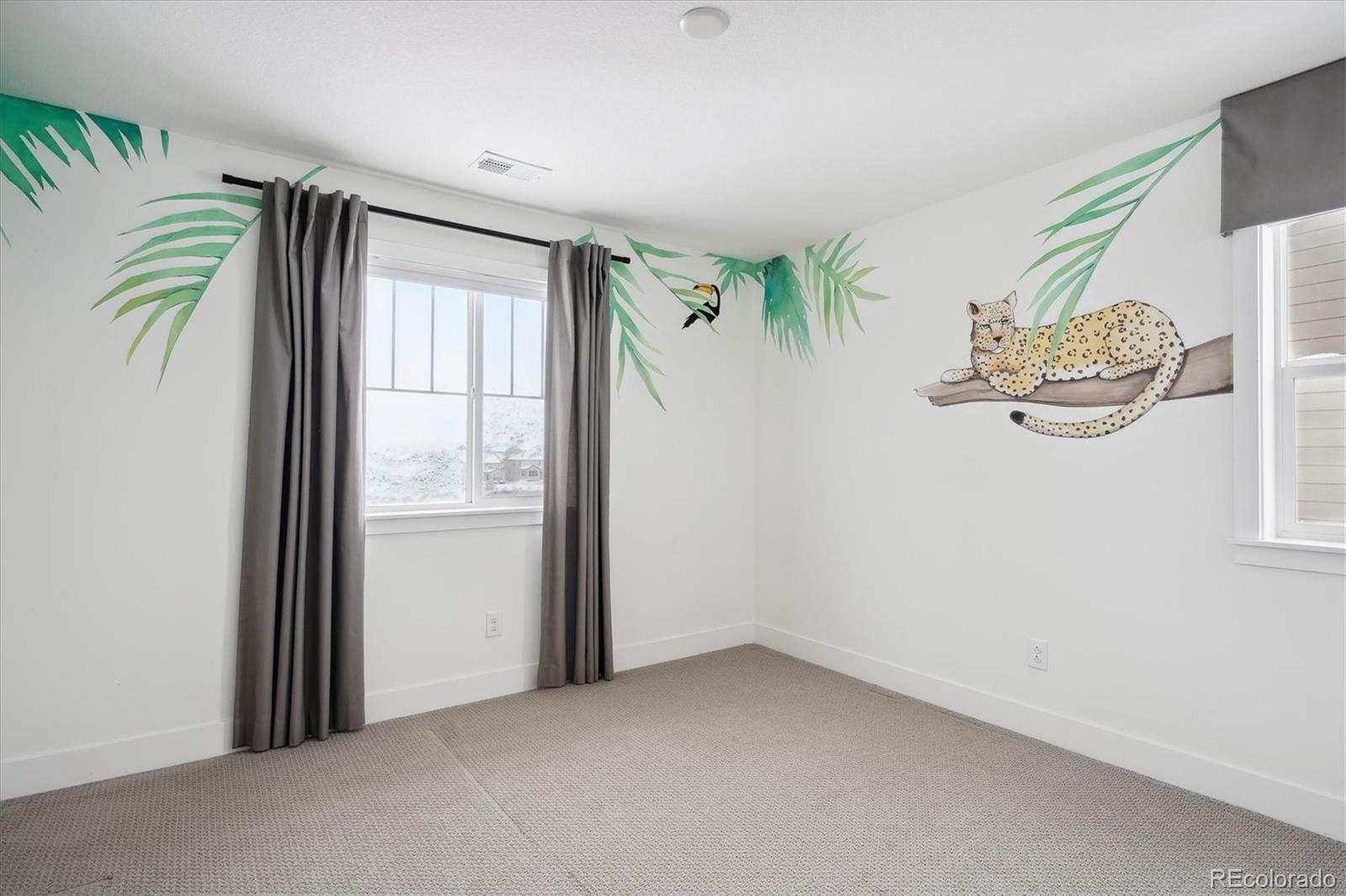 12841 Red Rosa Circle Parker, CO 80134 - Photo 21 of 29 an empty room with a painting on the wall