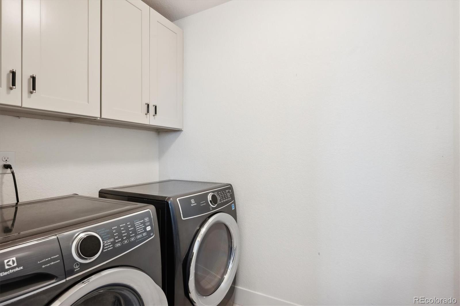 12841 Red Rosa Circle Parker, CO 80134 - Photo 22 of 29 a utility room with dryer and washer