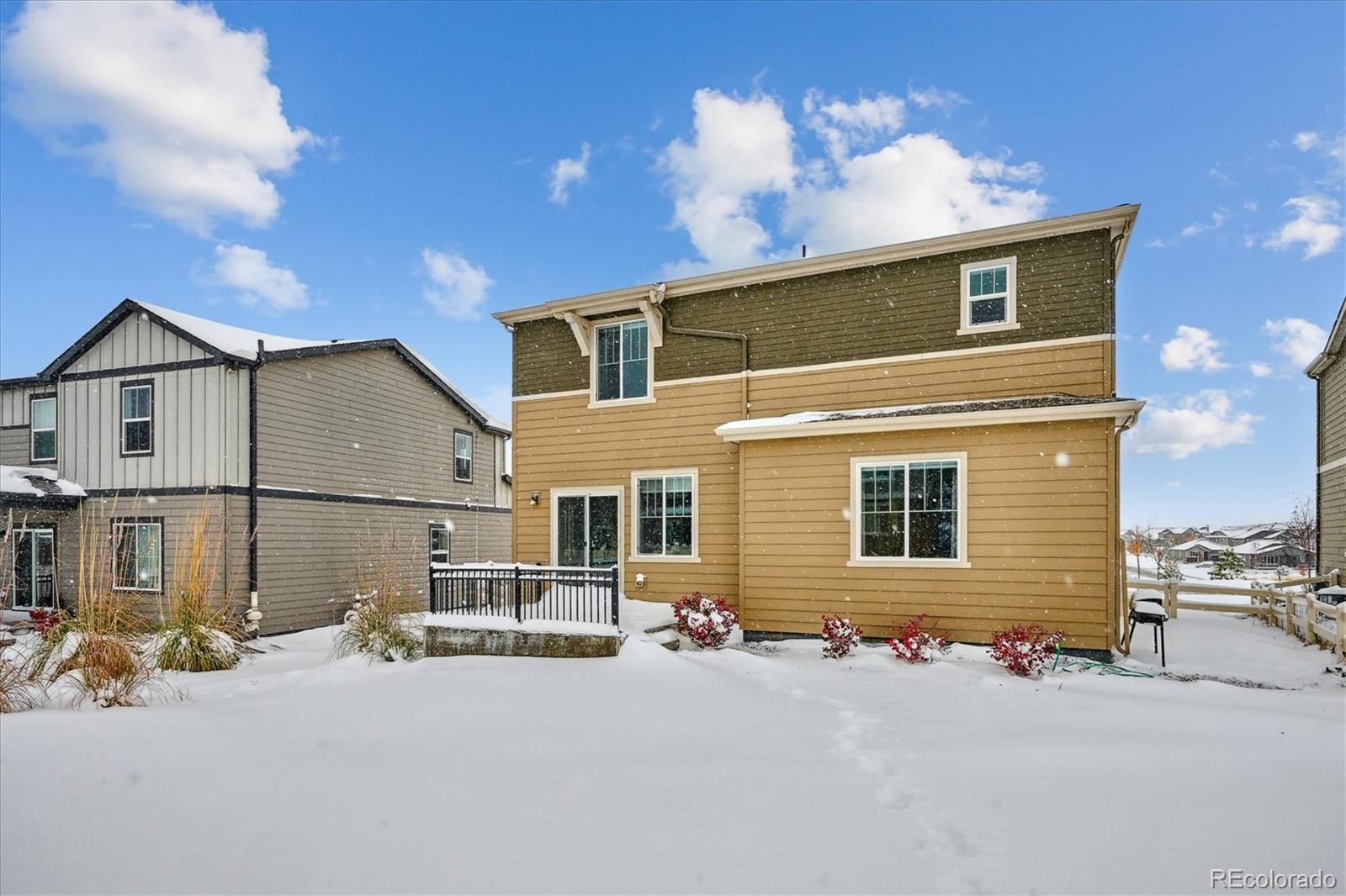 12841 Red Rosa Circle Parker, CO 80134 - Photo 24 of 29 a front view of a house with a yard