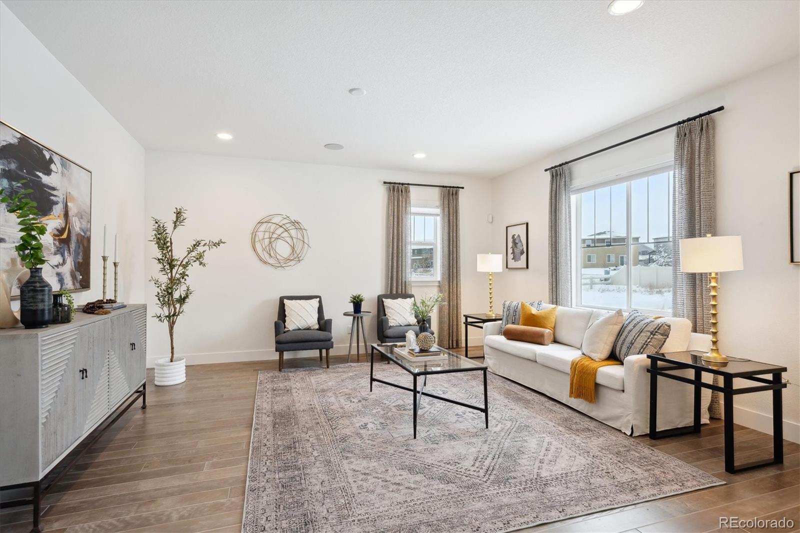 12841 Red Rosa Circle Parker, CO 80134 - Photo 8 of 29 a living room with furniture and a large window