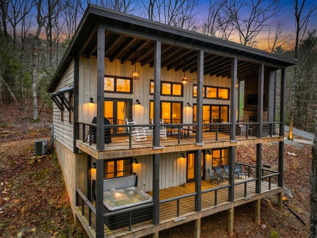 171 Cohutta Overlook Trail Blue Ridge, GA 30513 - Photo 1 of 47 a view of a small house with backyard and deck