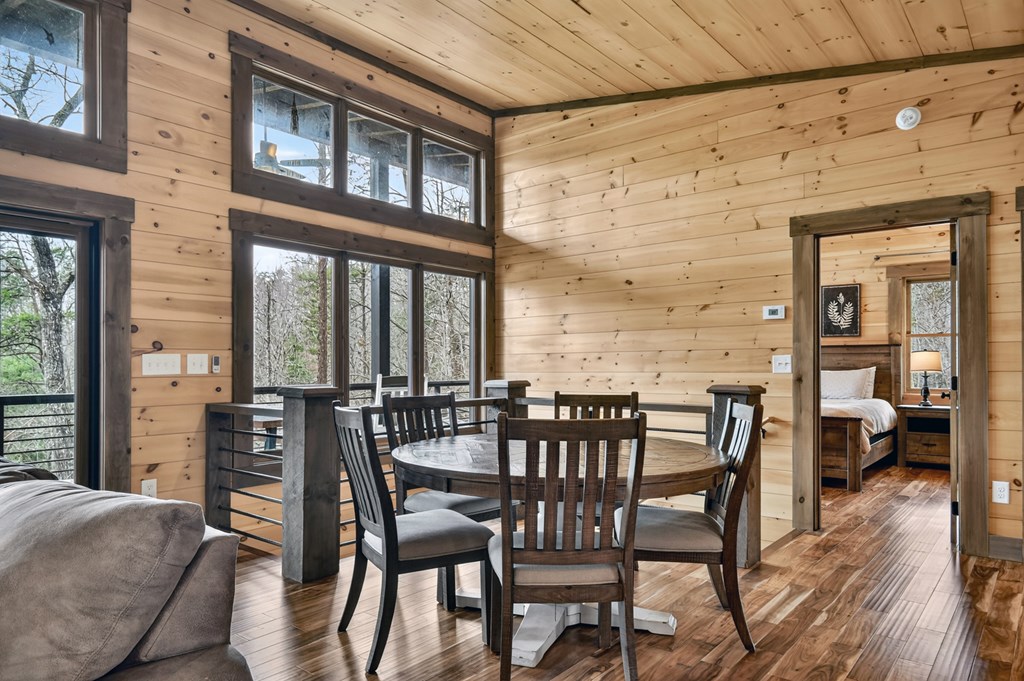 171 Cohutta Overlook Trail Blue Ridge, GA 30513 - Photo 16 of 47 a view of a dining room with furniture window and wooden floor