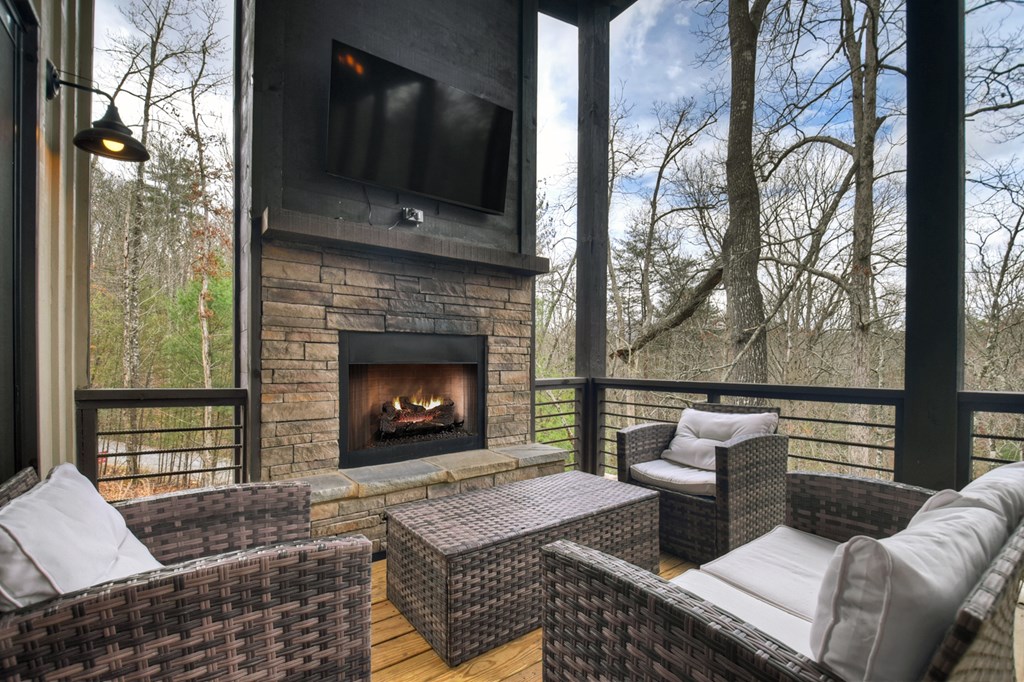 171 Cohutta Overlook Trail Blue Ridge, GA 30513 - Photo 23 of 47 a living room with furniture and a fireplace