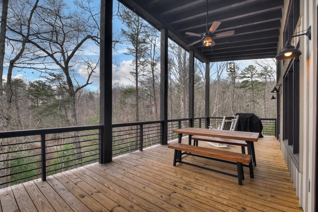 171 Cohutta Overlook Trail Blue Ridge, GA 30513 - Photo 24 of 47 a view of a roof deck with wooden floor and outdoor seating