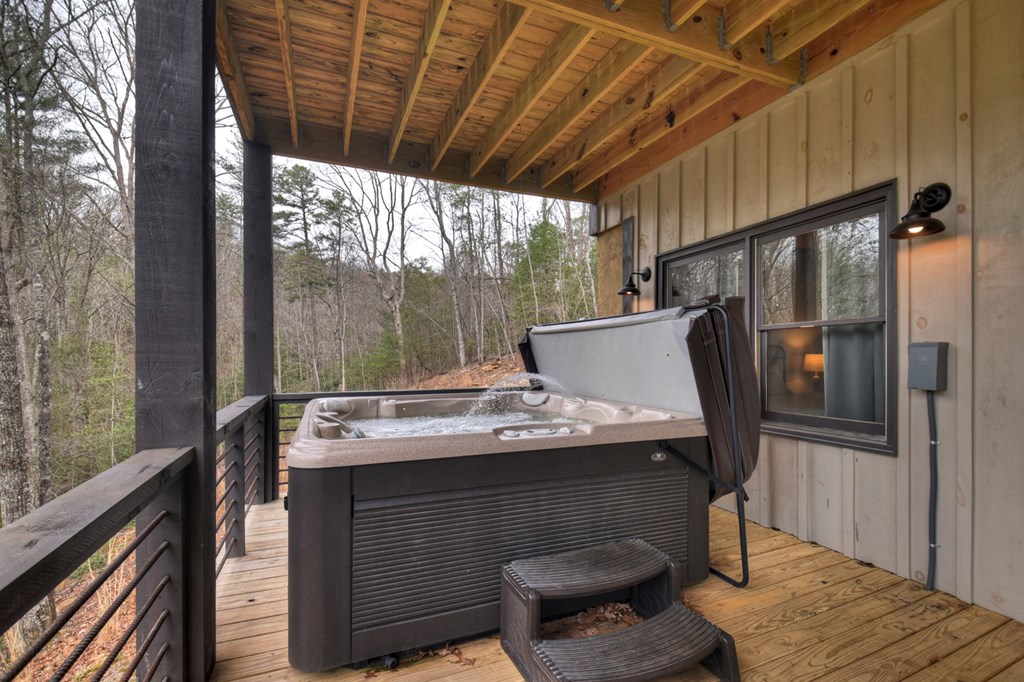 171 Cohutta Overlook Trail Blue Ridge, GA 30513 - Photo 37 of 47 a roof deck with table and chairs