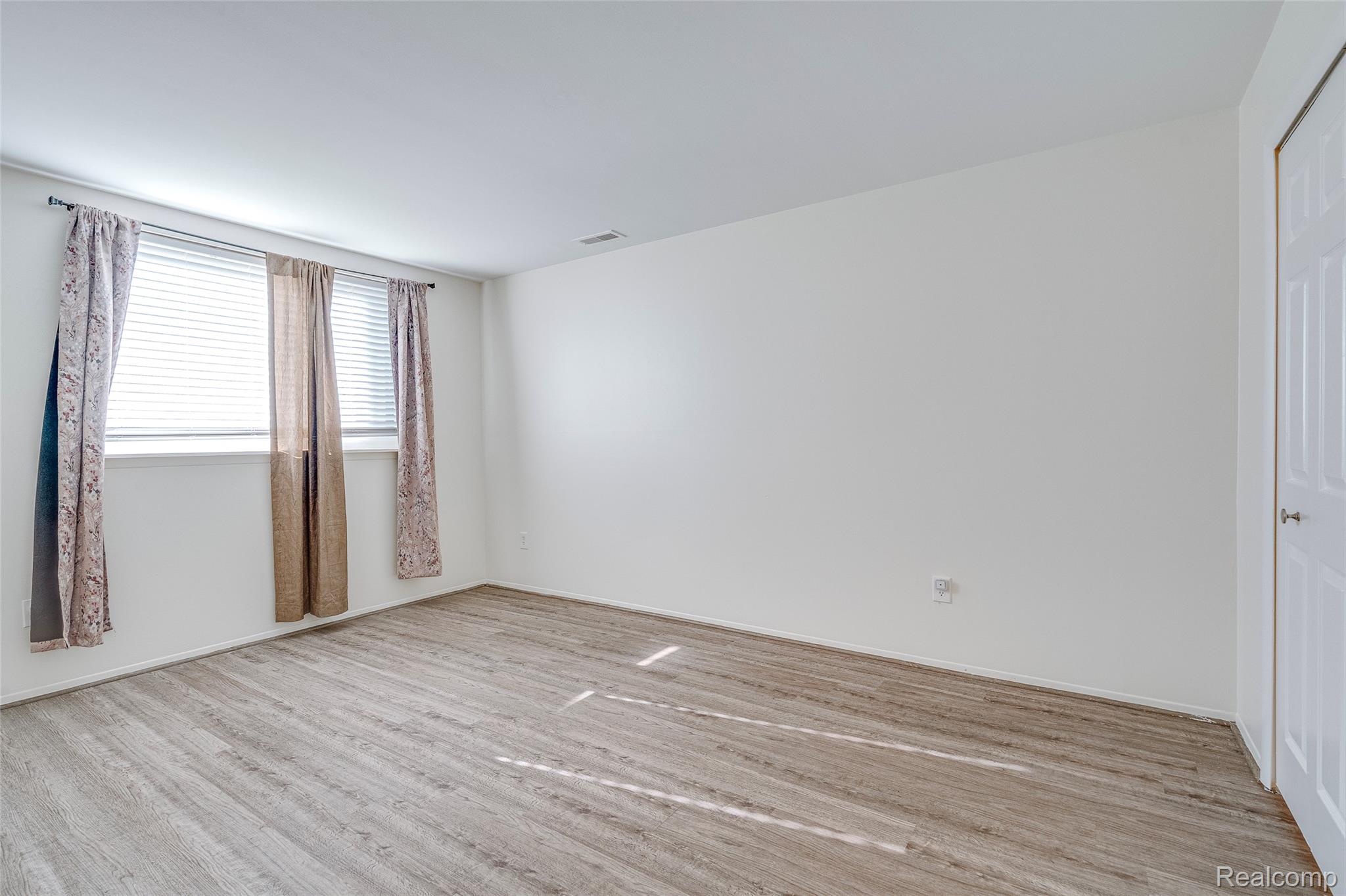 29860 West 12 Mile Road, Unit 604 Farmington, MI 48334 - Photo 13 of 26 Spare room with light wood-style floors