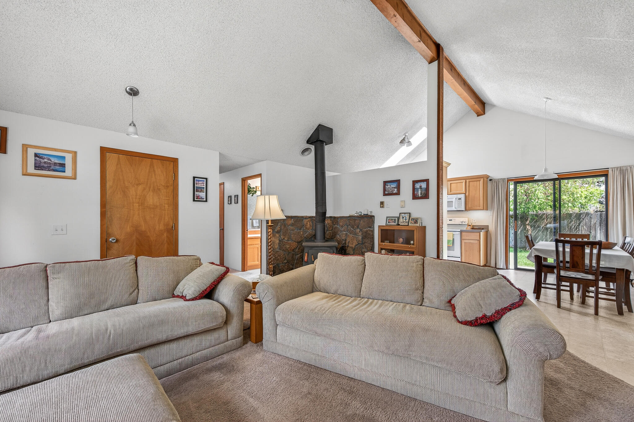 60866 Brosterhous Road Bend, OR 97702 - Photo 20 of 41 a living room with furniture kitchen view and a large window
