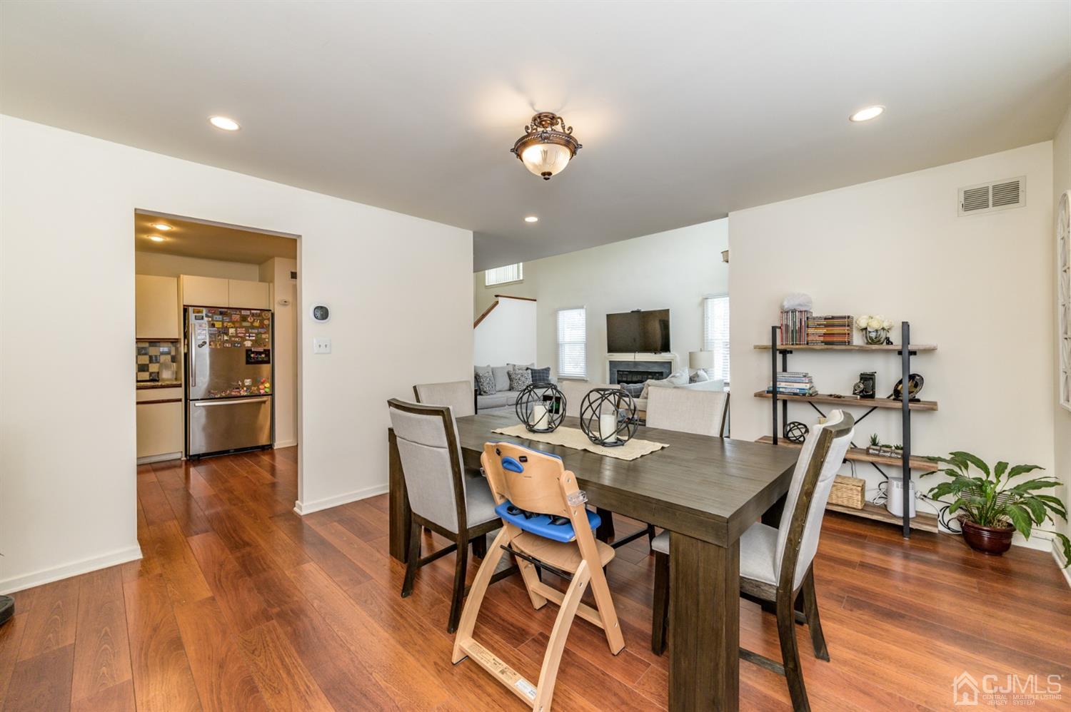 382 Waterview Road Bridgewater, NJ 08807 - Photo 12 of 30 a view of a dining room with furniture and wooden floor