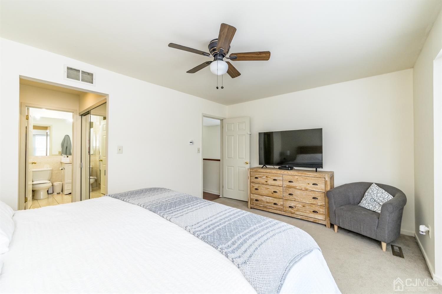 382 Waterview Road Bridgewater, NJ 08807 - Photo 16 of 30 a bedroom with a bed and a flat screen tv
