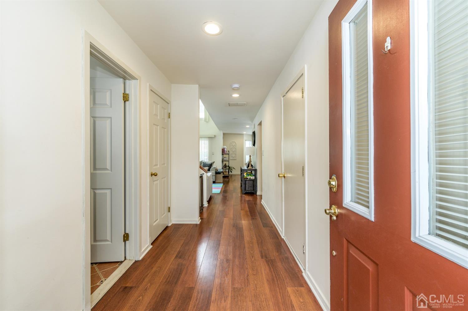 382 Waterview Road Bridgewater, NJ 08807 - Photo 3 of 30 a view of a hallway with wooden floor and staircase