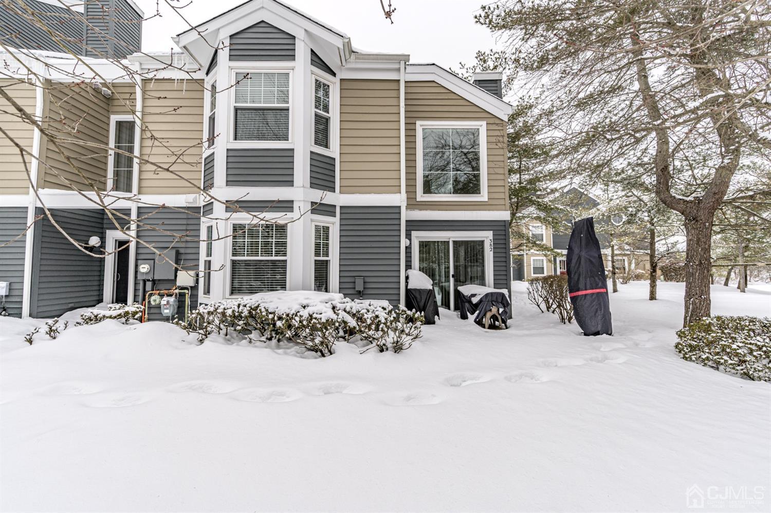 382 Waterview Road Bridgewater, NJ 08807 - Photo 29 of 30 a view of a house with a yard covered in snow