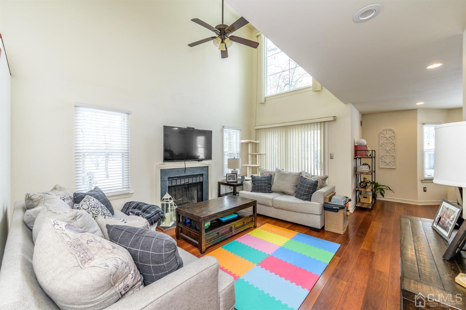 382 Waterview Road Bridgewater, NJ 08807 - Photo 5 of 30 a living room with furniture and a flat screen tv