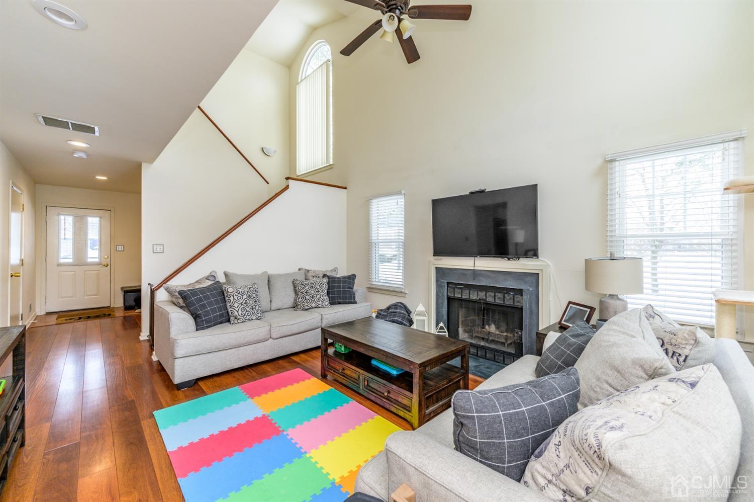 382 Waterview Road Bridgewater, NJ 08807 - Photo 6 of 30 a living room with fireplace furniture and a flat screen tv