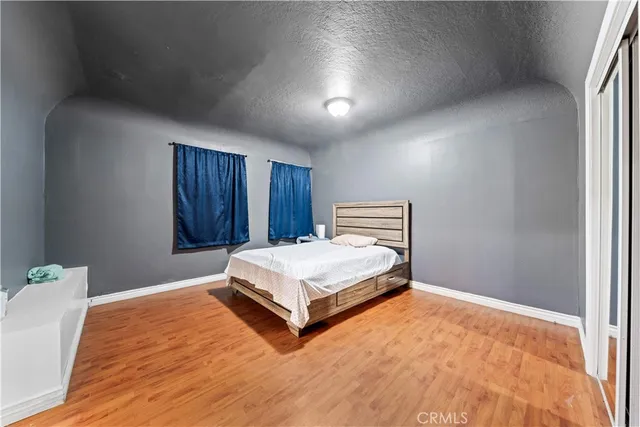 a bedroom with a bed and window