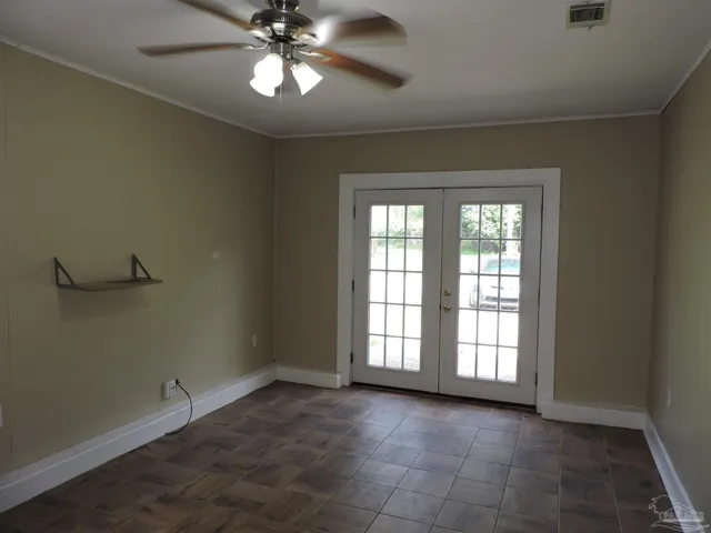 a view of an empty room with a window