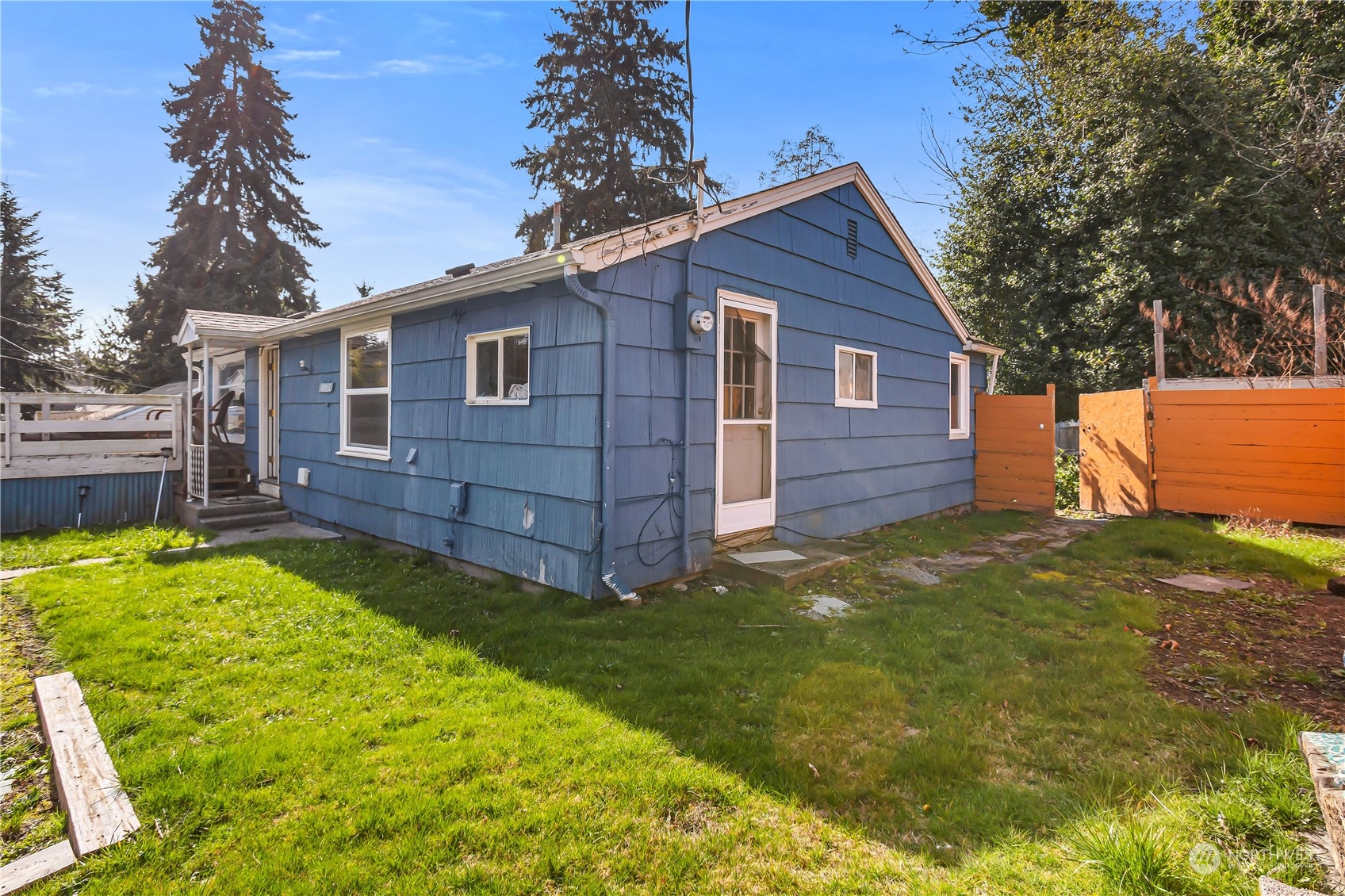 10057 24th Avenue Southwest Seattle, WA 98146 - Photo 1 of 23 front view of a house with a yard