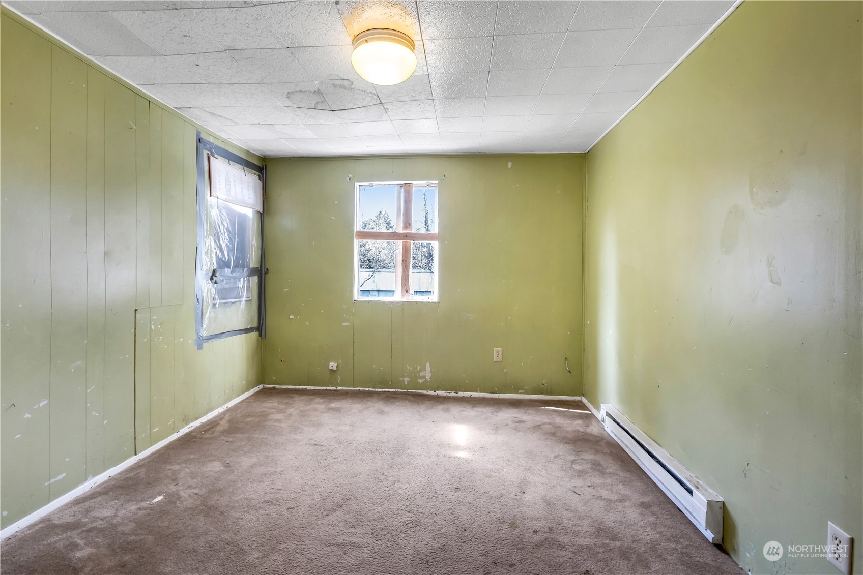 10057 24th Avenue Southwest Seattle, WA 98146 - Photo 12 of 23 an empty room with windows