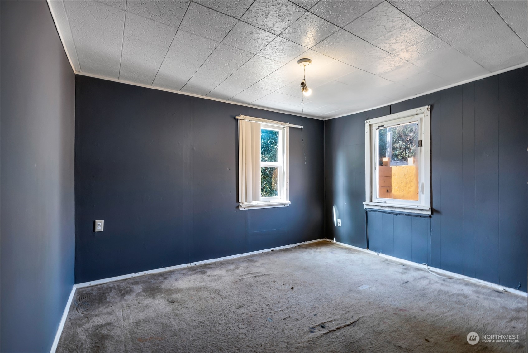 10057 24th Avenue Southwest Seattle, WA 98146 - Photo 13 of 23 a view of a big room with windows and chandelier fan