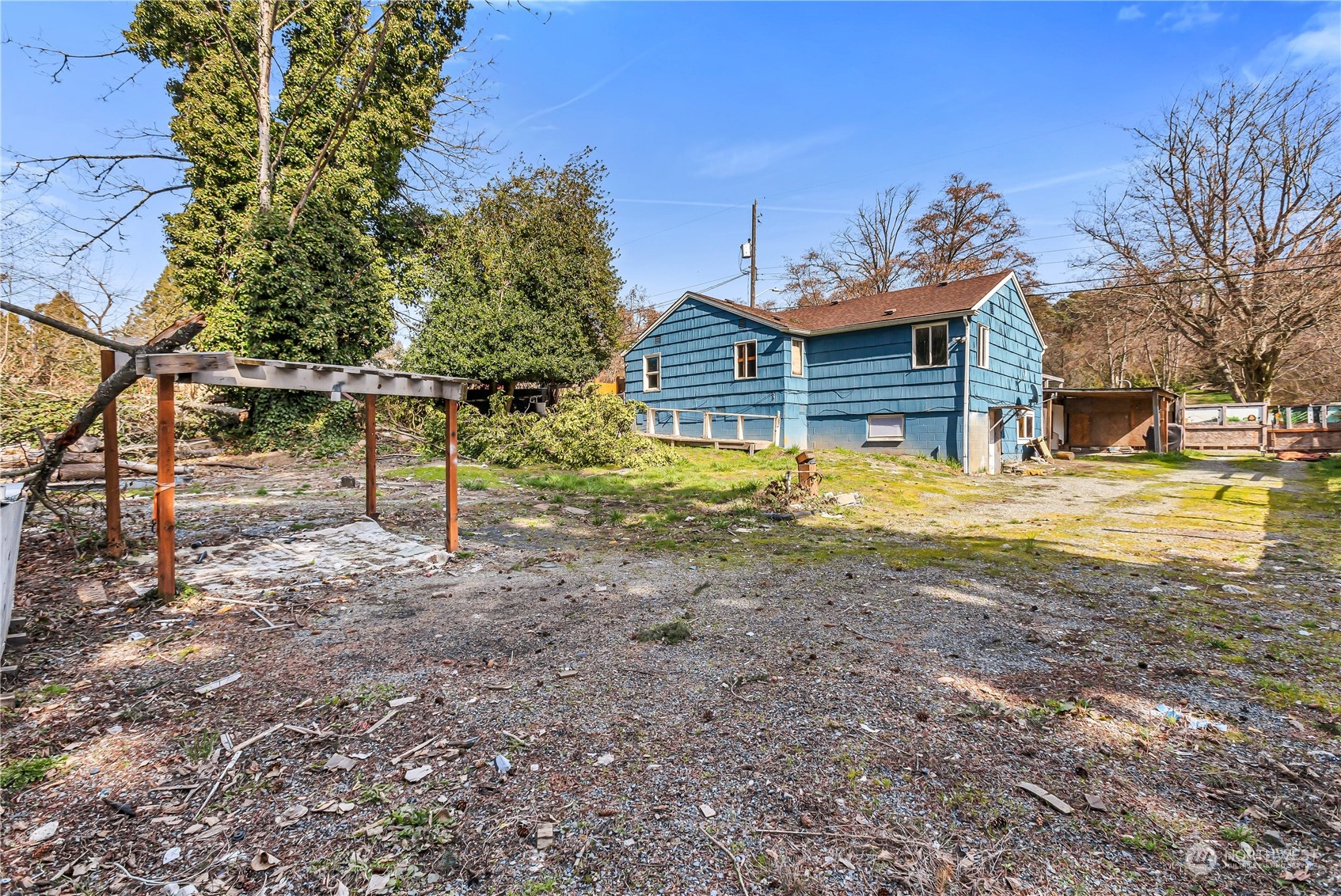 10057 24th Avenue Southwest Seattle, WA 98146 - Photo 17 of 23 a view of a house with a yard