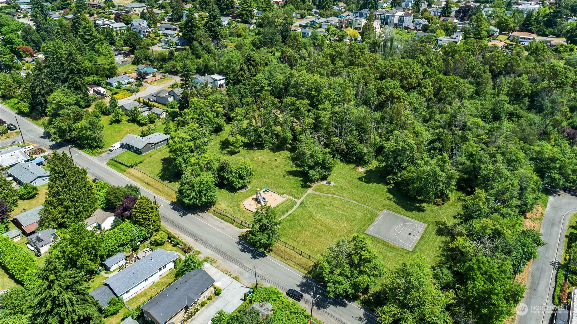 10057 24th Avenue Southwest Seattle, WA 98146 - Photo 22 of 23 an aerial view of a house with a yard
