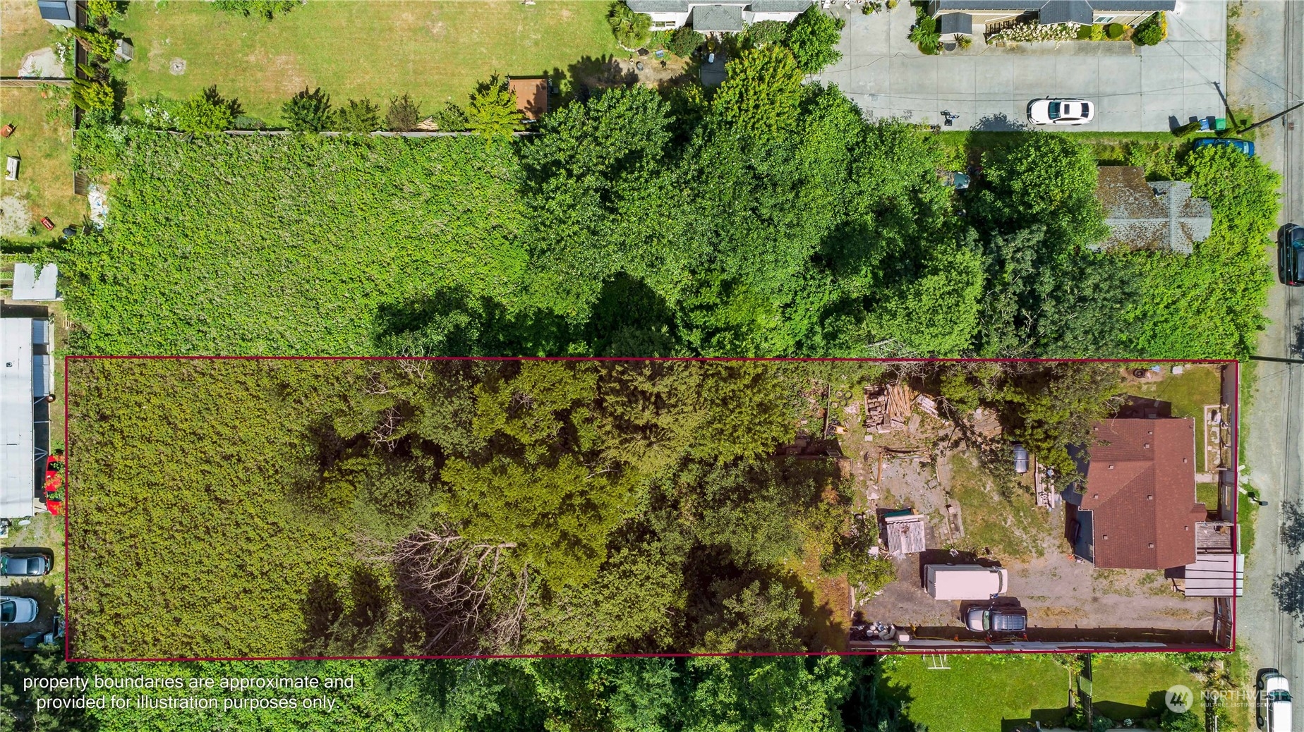 10057 24th Avenue Southwest Seattle, WA 98146 - Photo 4 of 23 an aerial view of residential house with outdoor space and trees all around