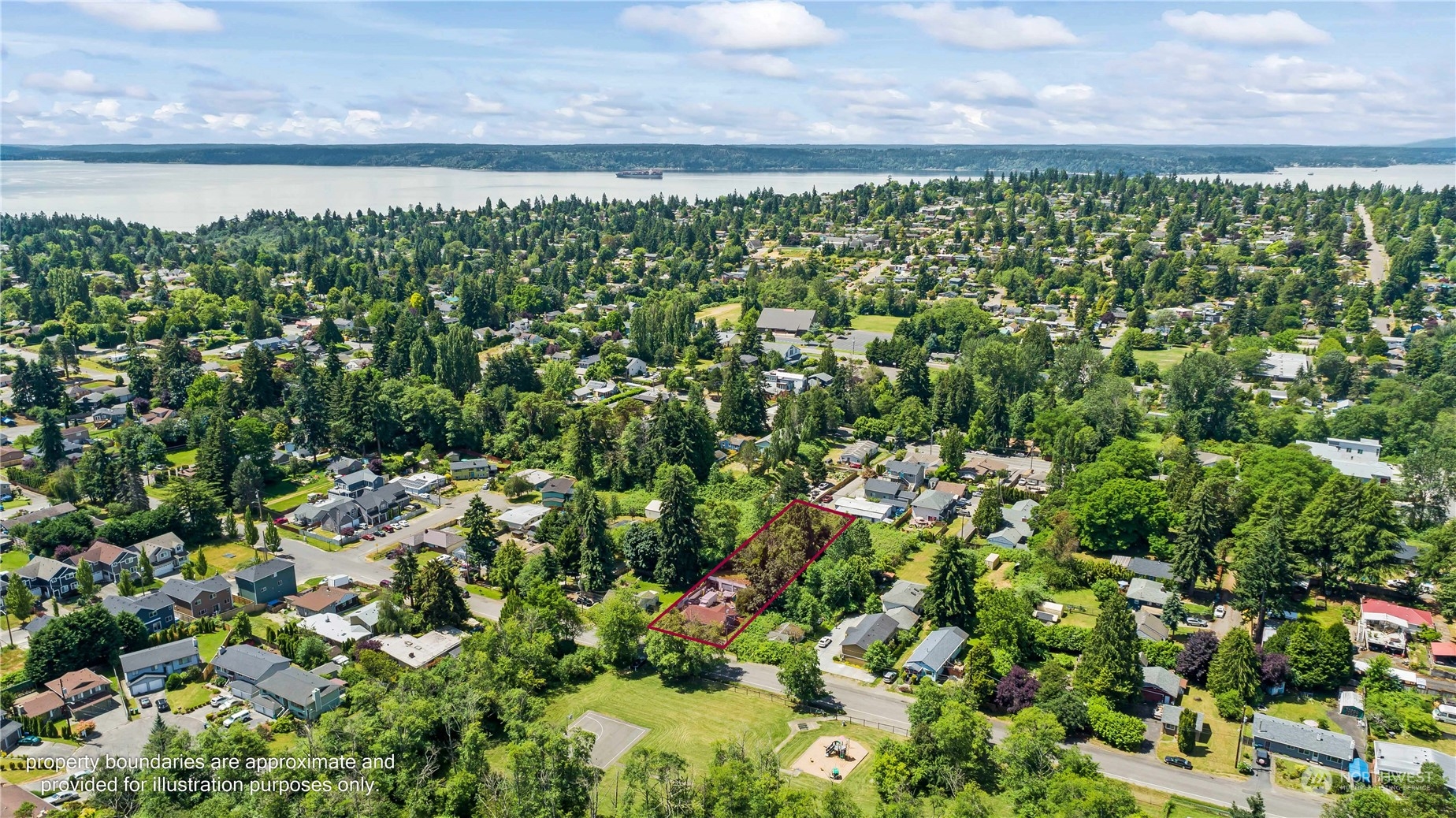10057 24th Avenue Southwest Seattle, WA 98146 - Photo 5 of 23 a view of a lake with a city