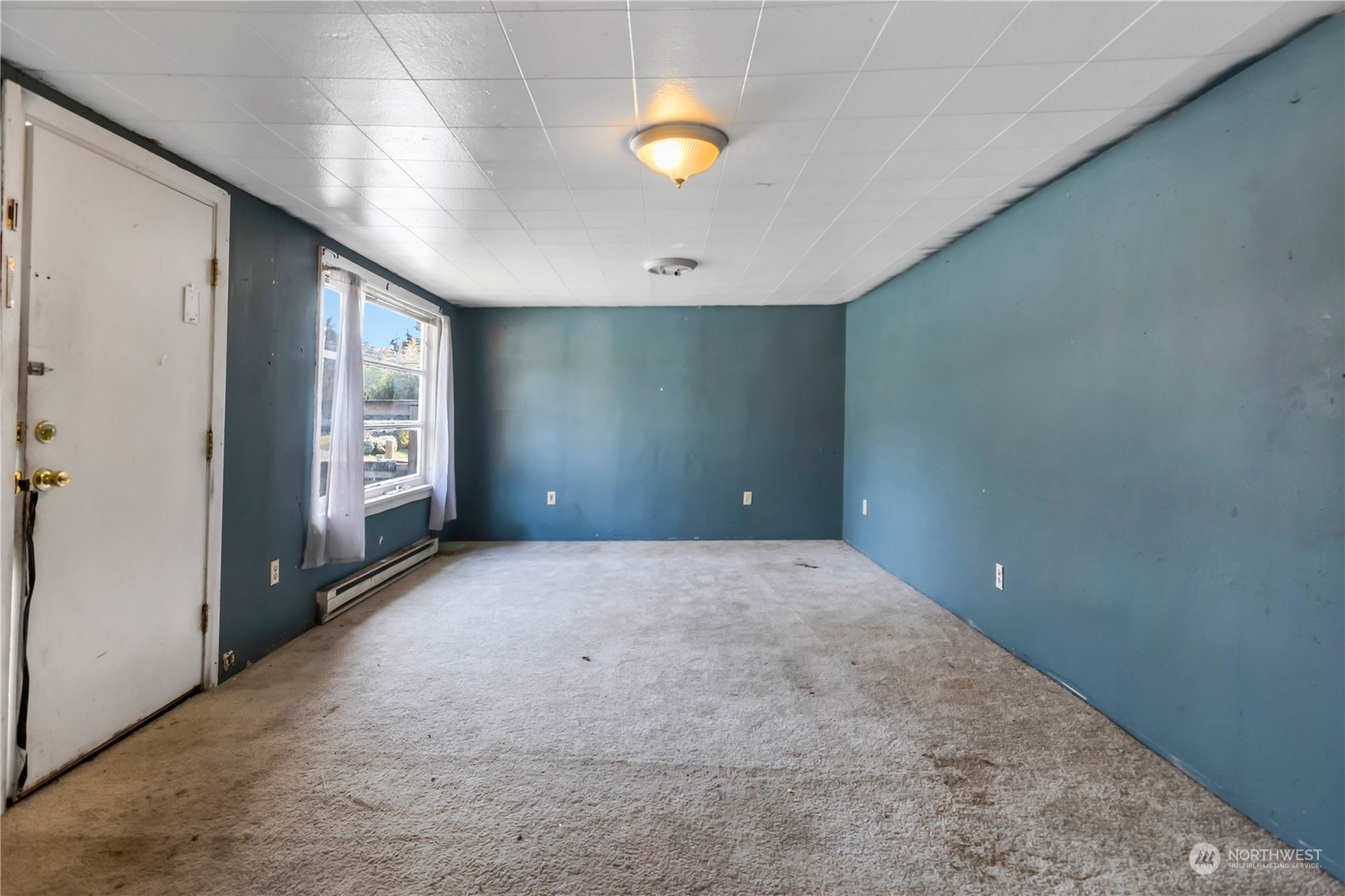 10057 24th Avenue Southwest Seattle, WA 98146 - Photo 6 of 23 a view of an empty room