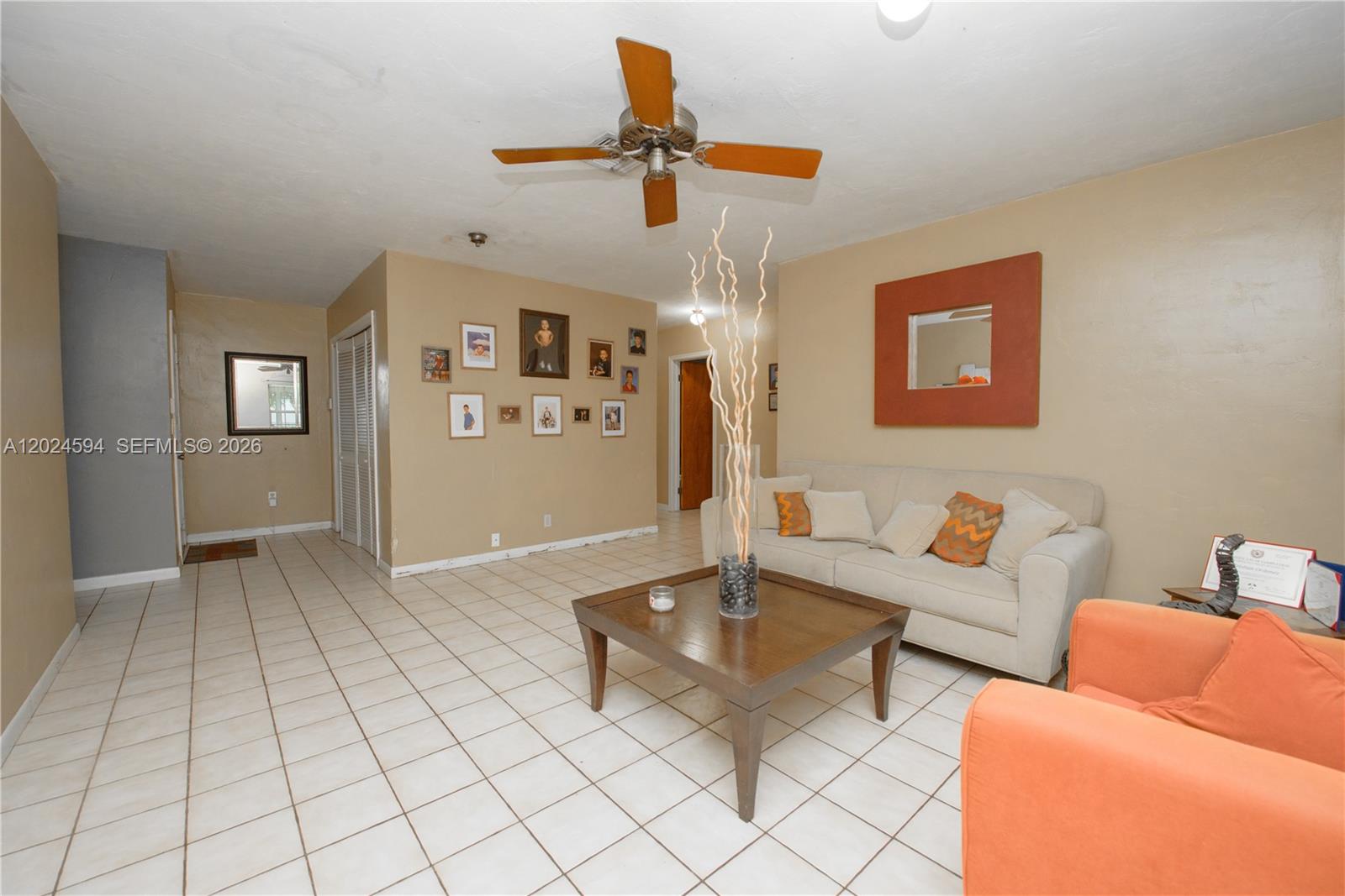 17355 Southwest 256th Street Homestead, FL 33031 - Photo 7 of 32 a living room with furniture and a ceiling fan