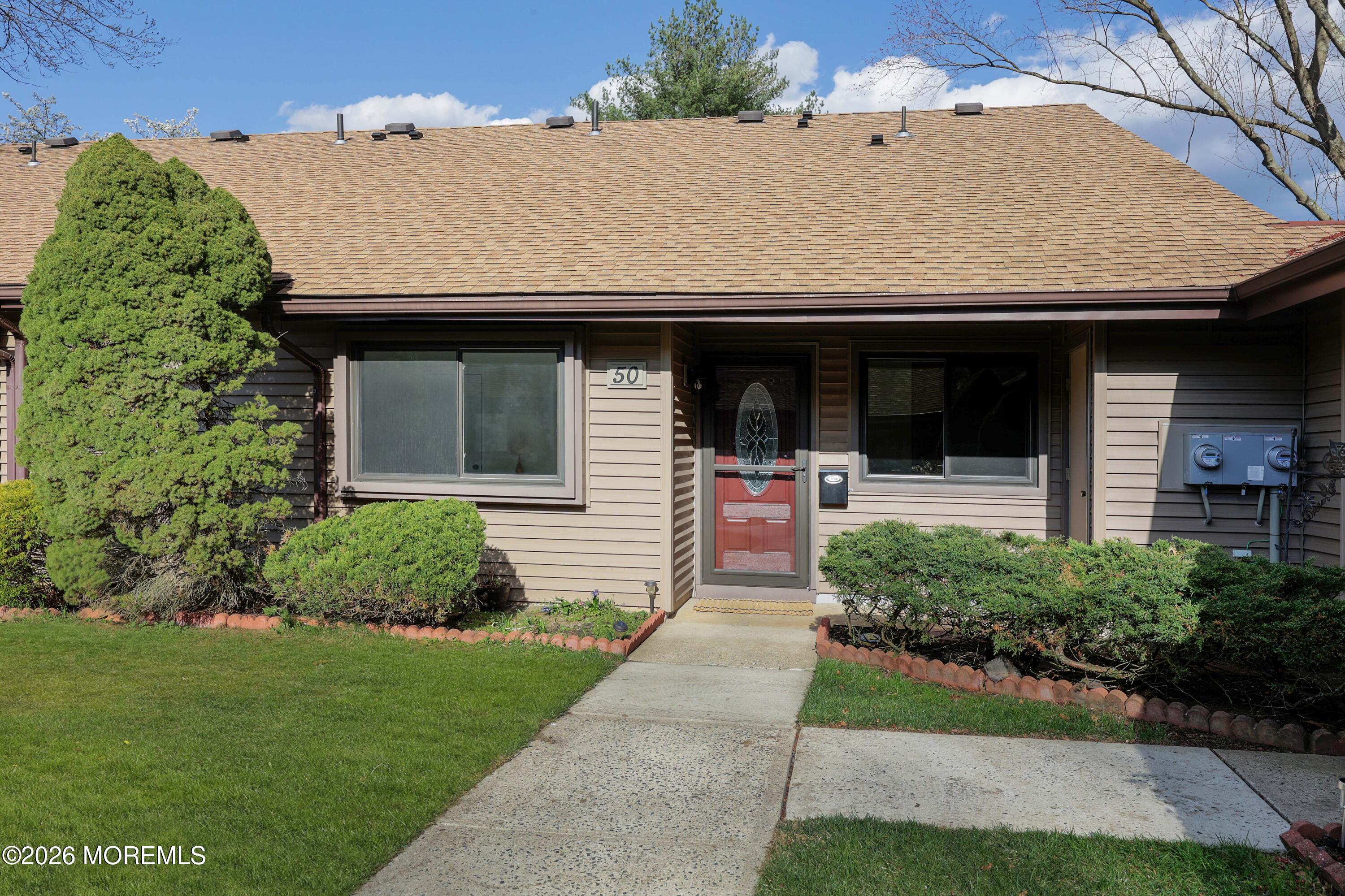 50 Hanover Court Red Bank, NJ 07701 - Photo 2 of 37 a front view of a house with a yard