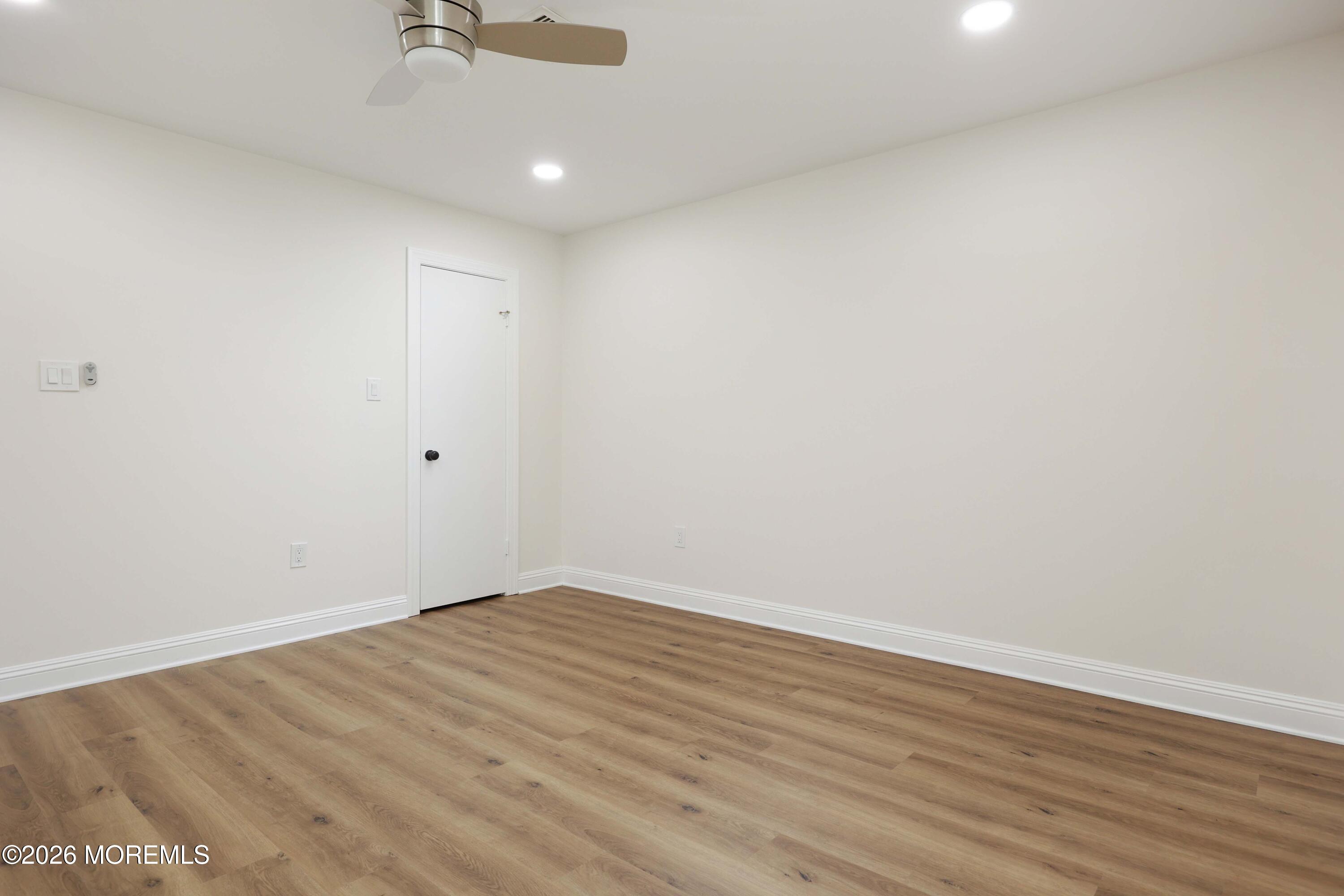50 Hanover Court Red Bank, NJ 07701 - Photo 21 of 37 wooden floor in an empty room