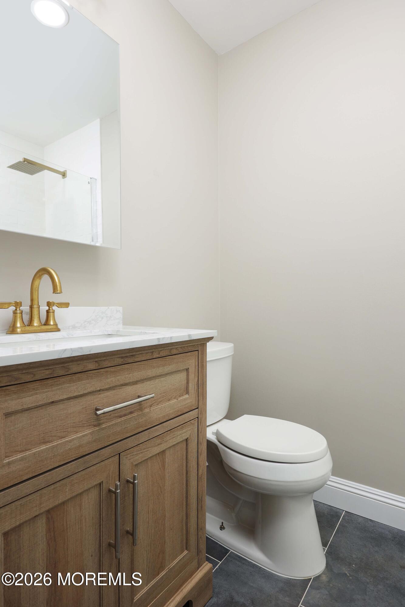 50 Hanover Court Red Bank, NJ 07701 - Photo 24 of 37 a bathroom with a toilet and a sink
