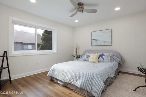 a bedroom with bed and a window
