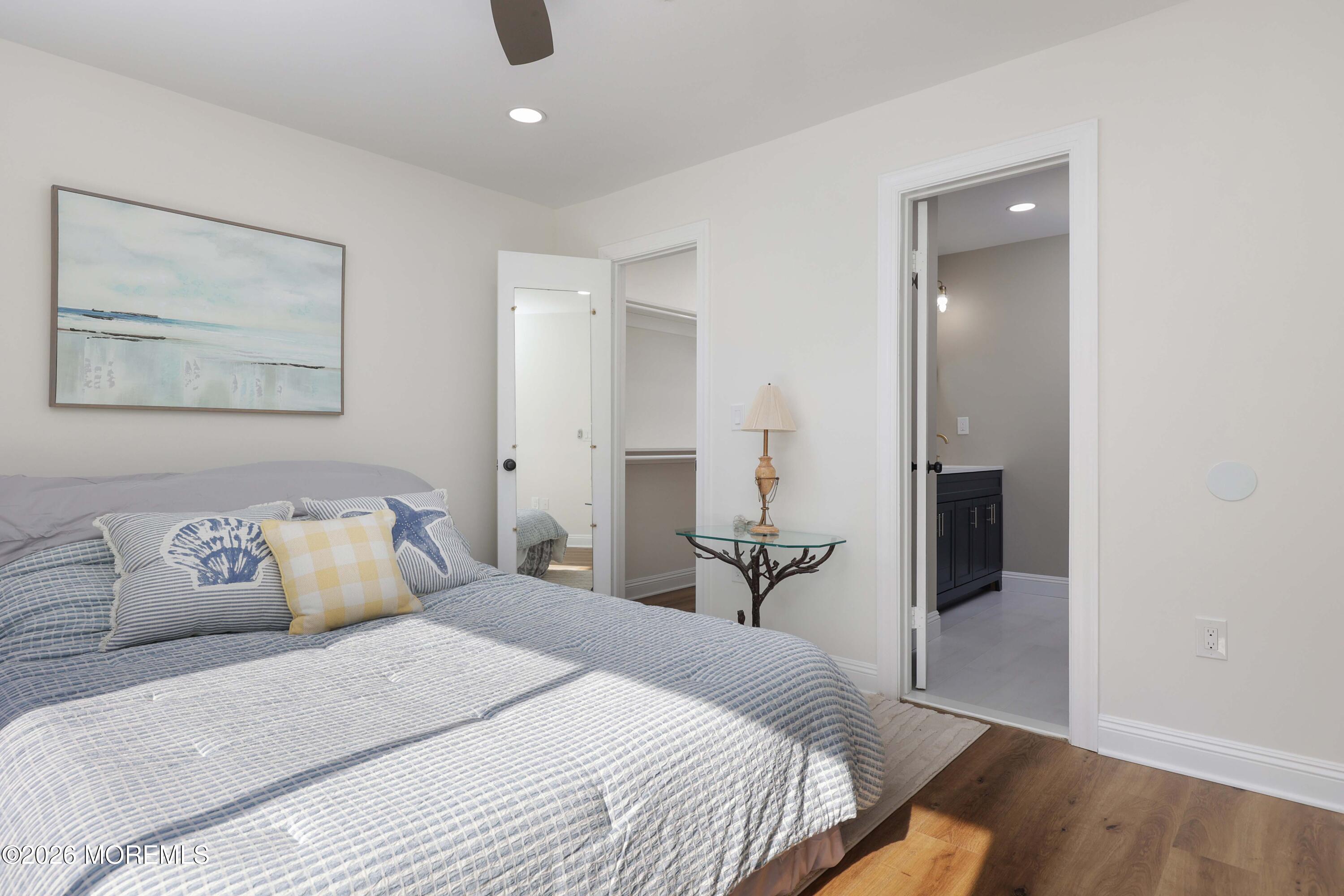 50 Hanover Court Red Bank, NJ 07701 - Photo 27 of 37 a bedroom with a bed and a painting on the wall