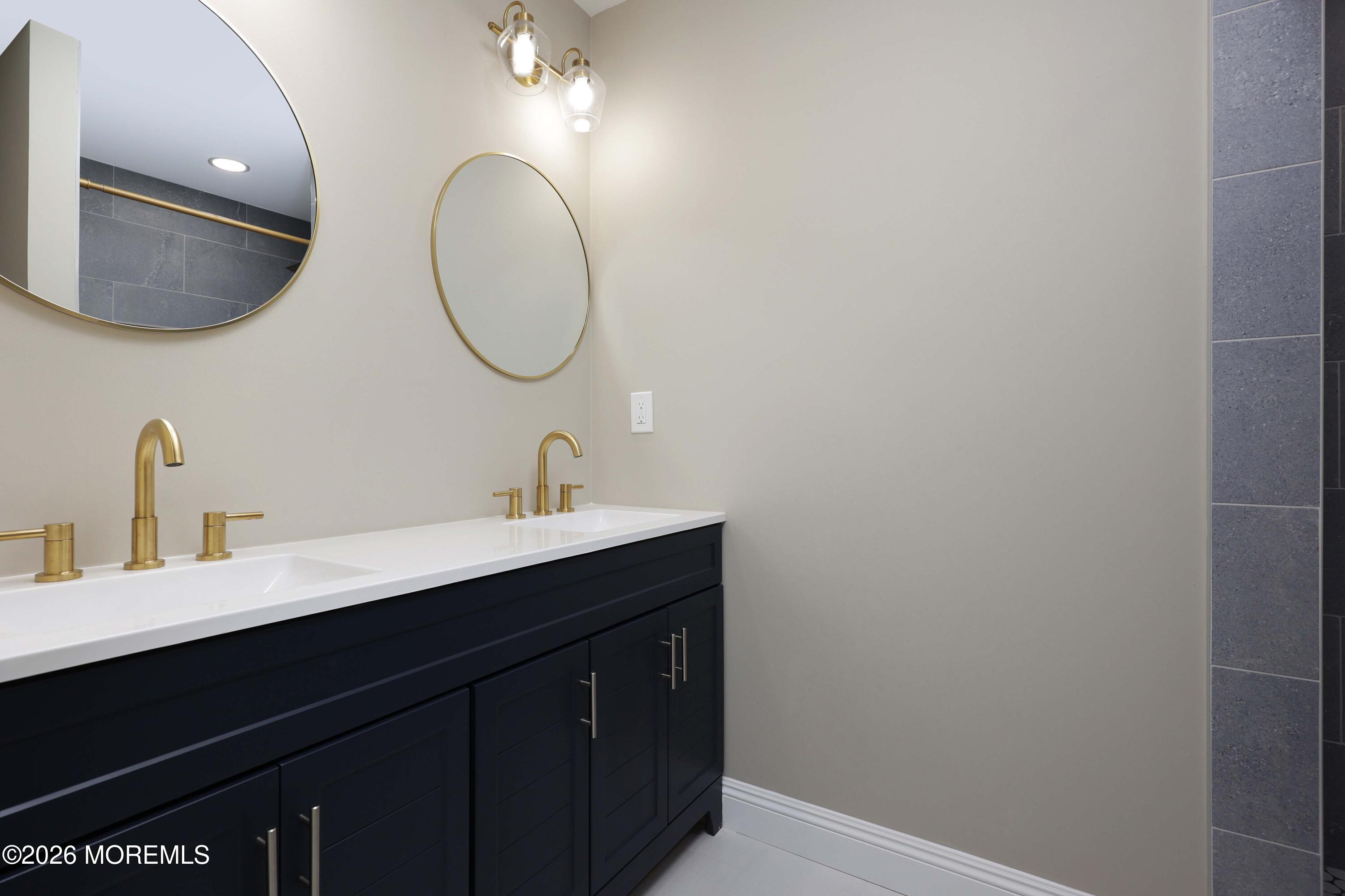 50 Hanover Court Red Bank, NJ 07701 - Photo 30 of 37 a bathroom with a sink and a mirror