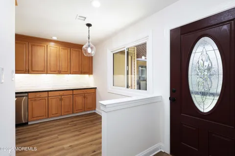 a view of living room with a sink and a window