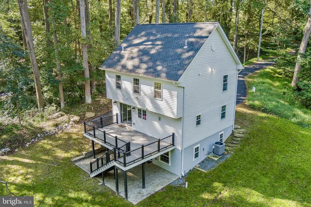 a aerial view of a house with backyard