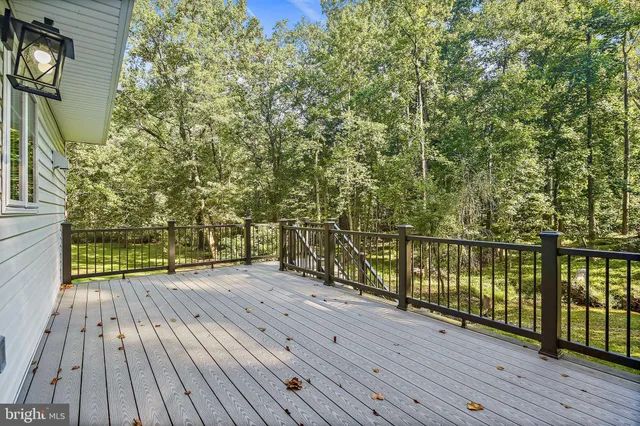 a view of a balcony with wooden floor