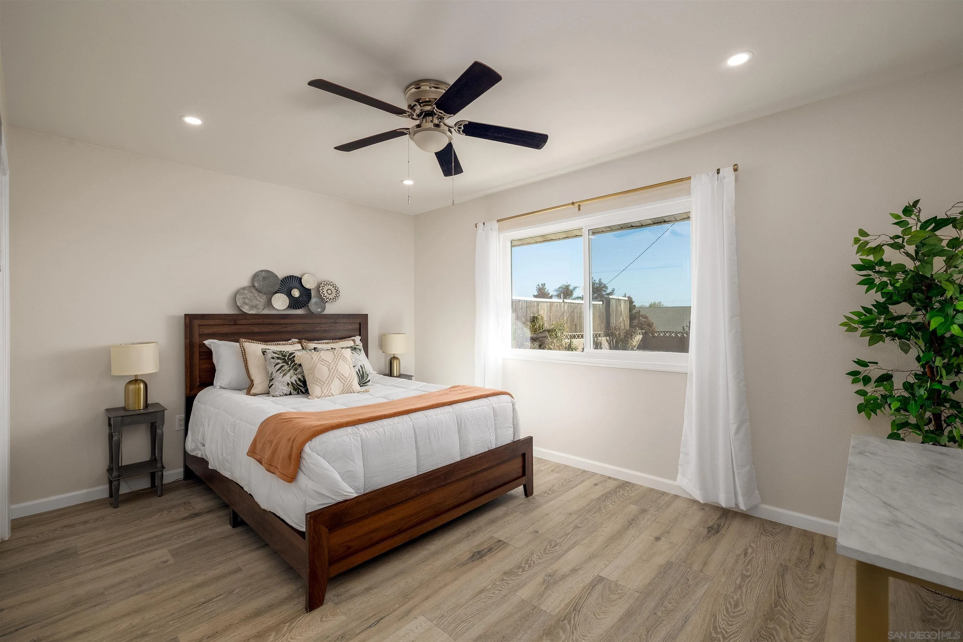 27431 El Rancho Road Menifee, CA 92586 - Photo 22 of 39 a bedroom with a bed and a potted plant
