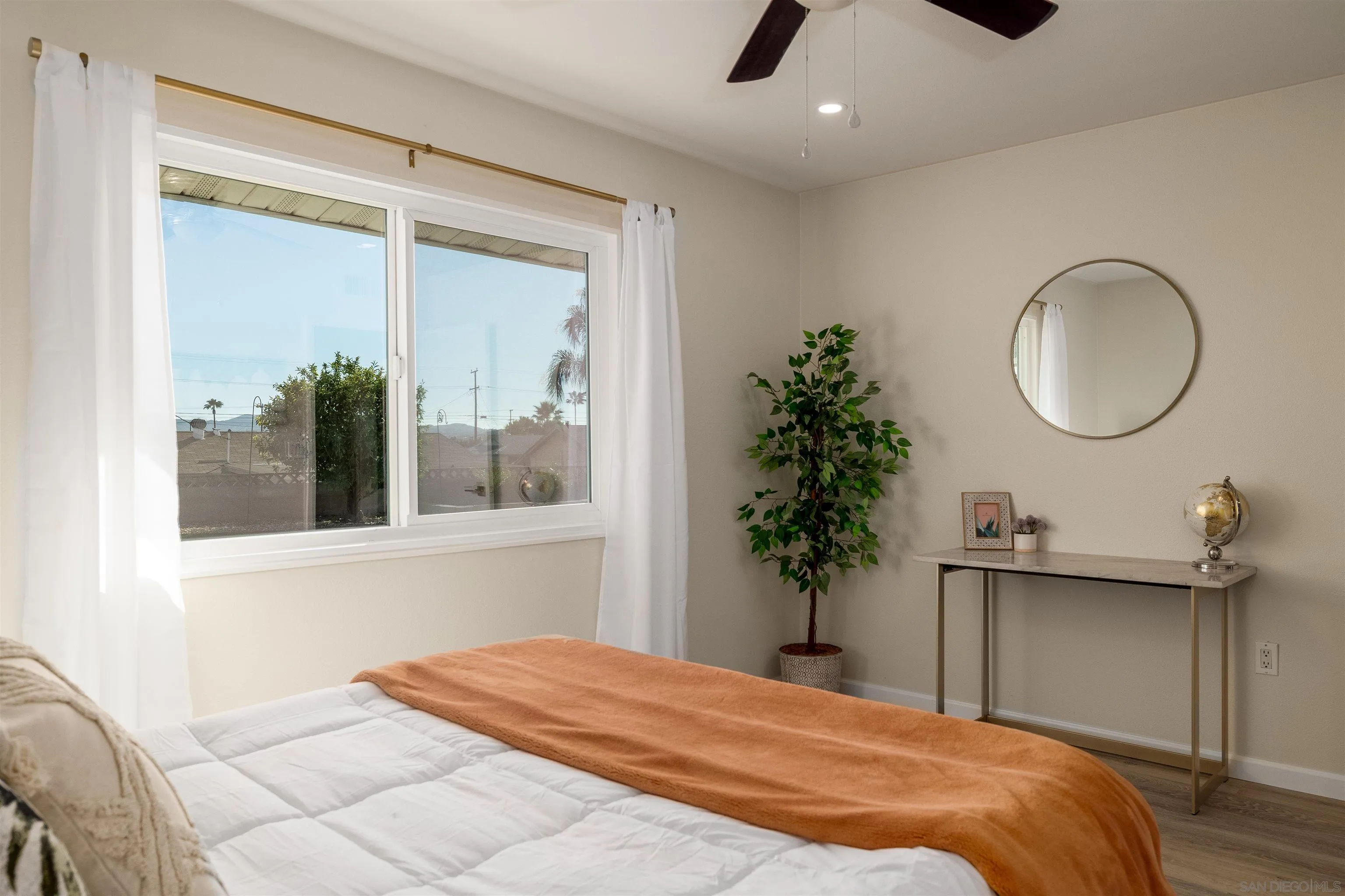 27431 El Rancho Road Menifee, CA 92586 - Photo 23 of 39 a bedroom with a bed and a potted plant