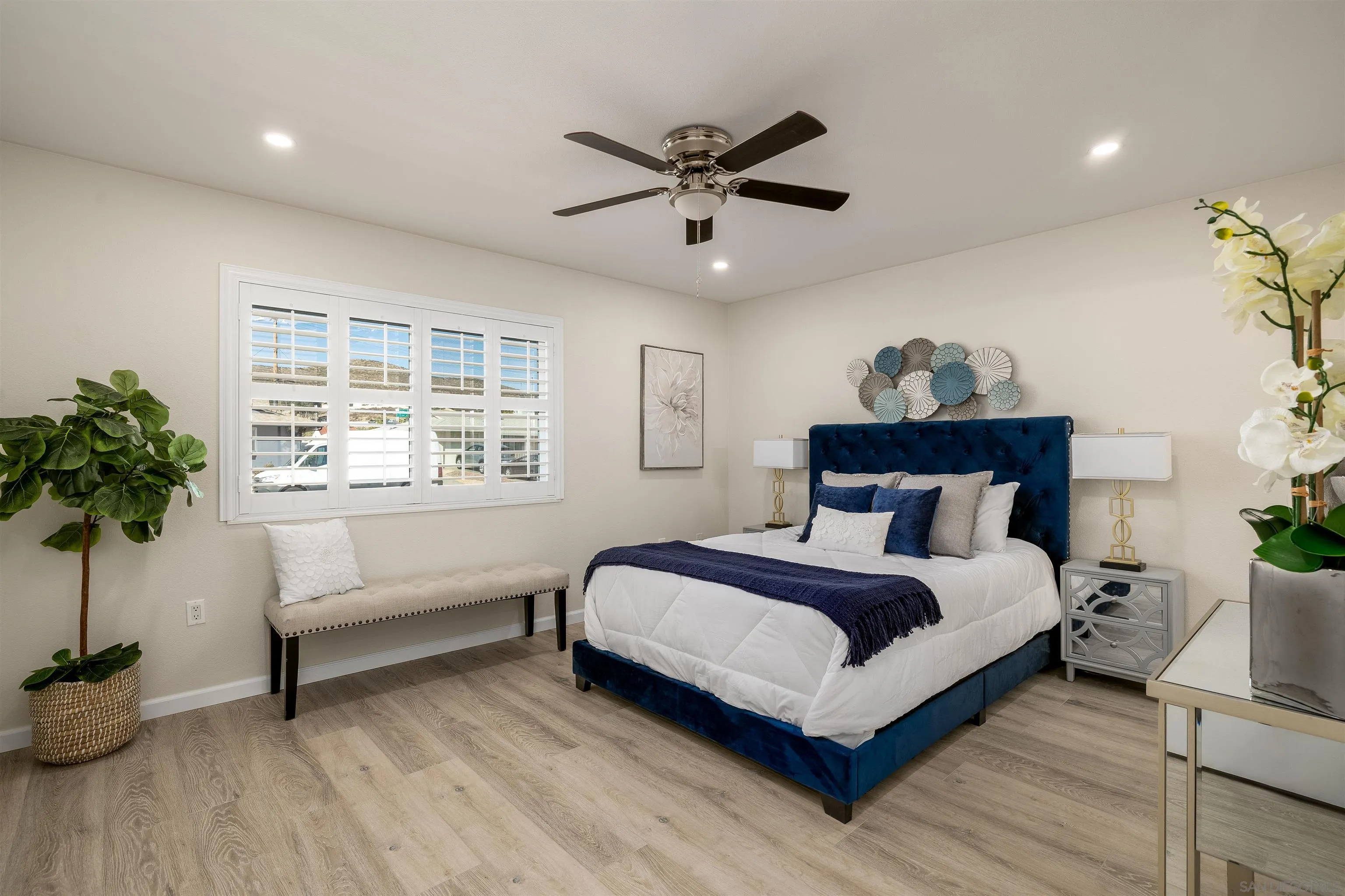 27431 El Rancho Road Menifee, CA 92586 - Photo 25 of 39 a bedroom with a bed and a potted plant