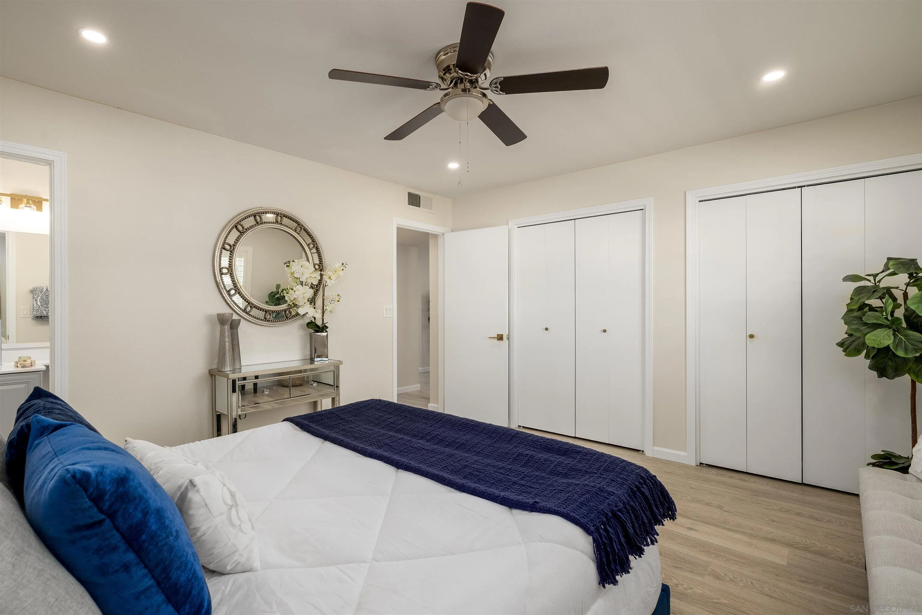 27431 El Rancho Road Menifee, CA 92586 - Photo 26 of 39 a bedroom with a bed and a chandelier