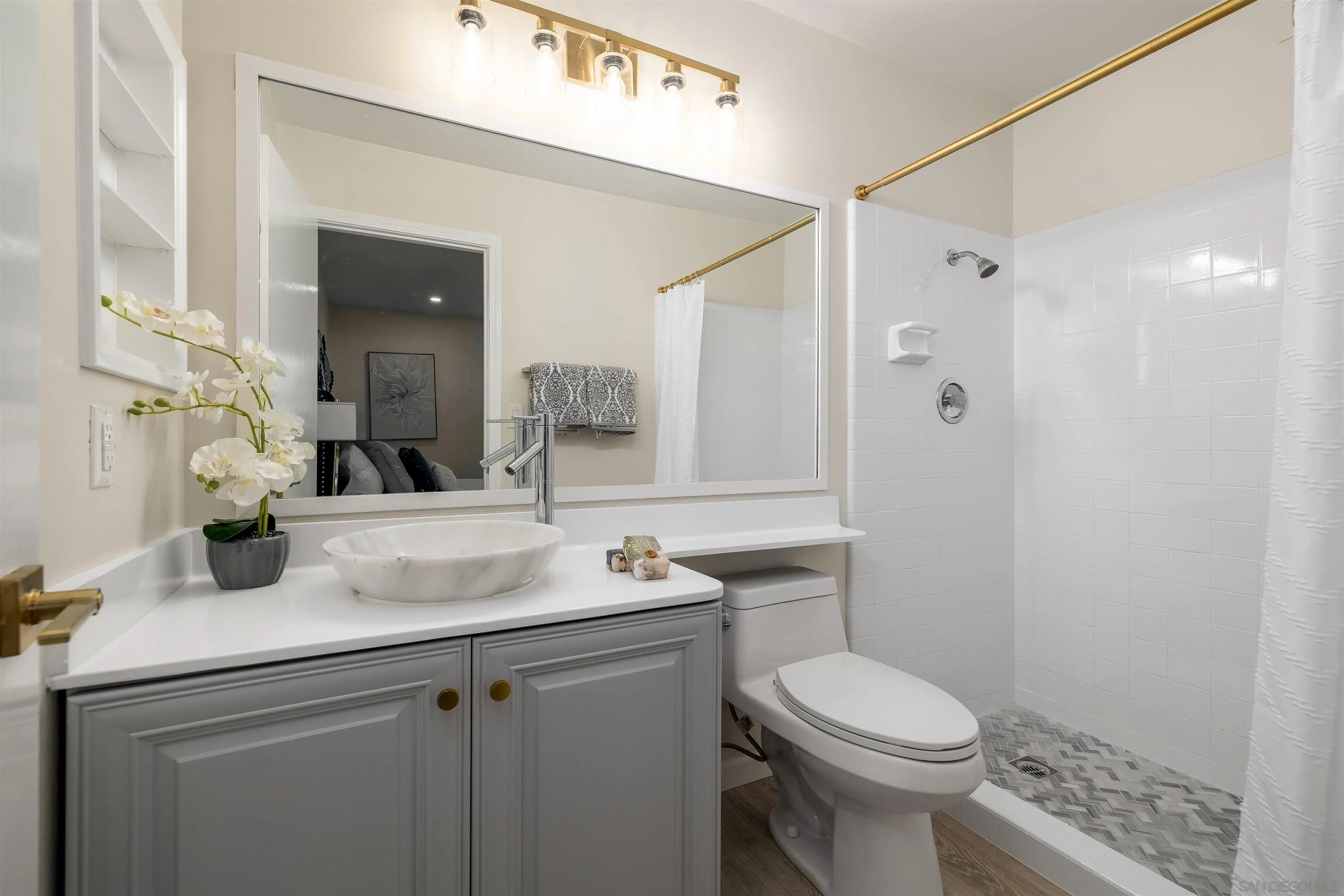 27431 El Rancho Road Menifee, CA 92586 - Photo 27 of 39 a bathroom with a sink toilet vanity and shower