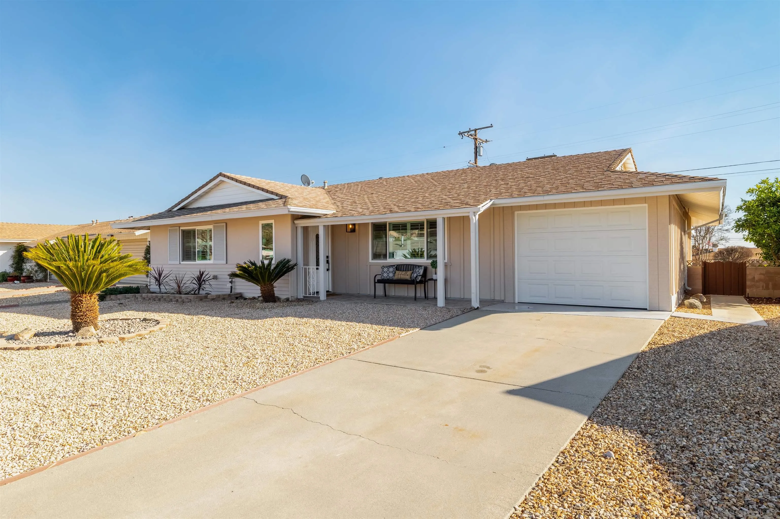 27431 El Rancho Road Menifee, CA 92586 - Photo 5 of 39 a front view of a house with a yard and garage