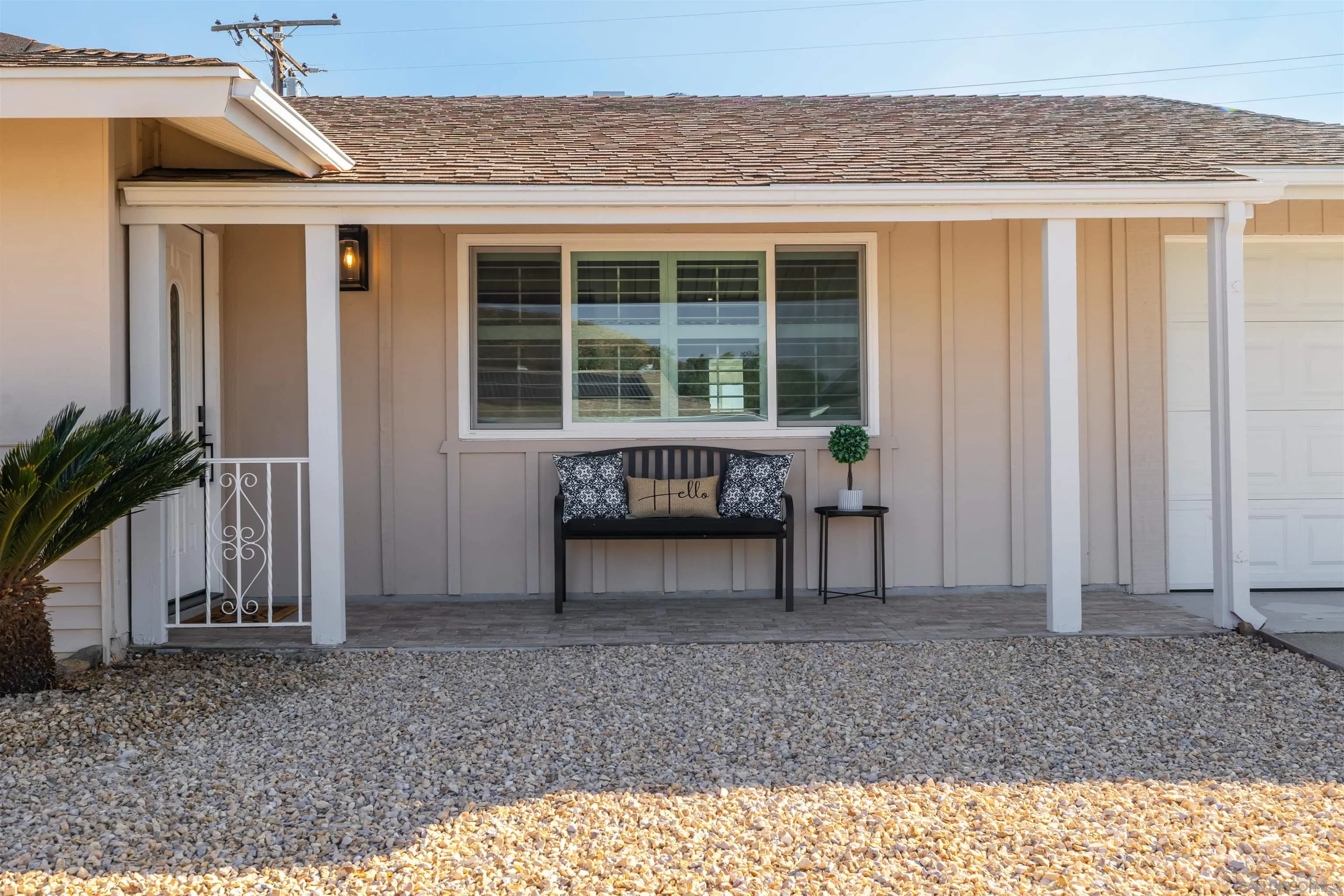 27431 El Rancho Road Menifee, CA 92586 - Photo 6 of 39 a view of a house with a balcony and floor to ceiling window