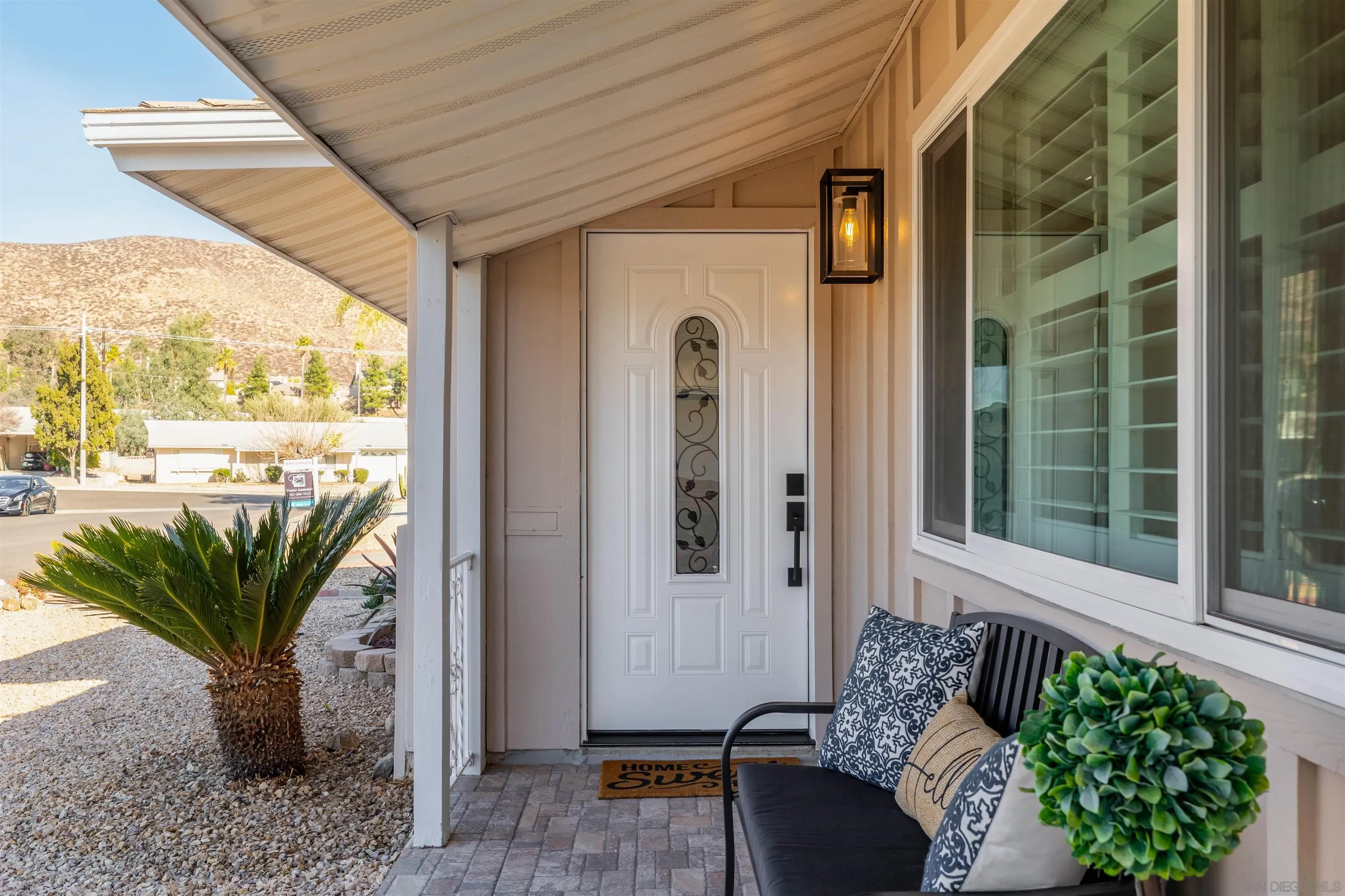 27431 El Rancho Road Menifee, CA 92586 - Photo 7 of 39 a view of a porch with furniture and a potted plant