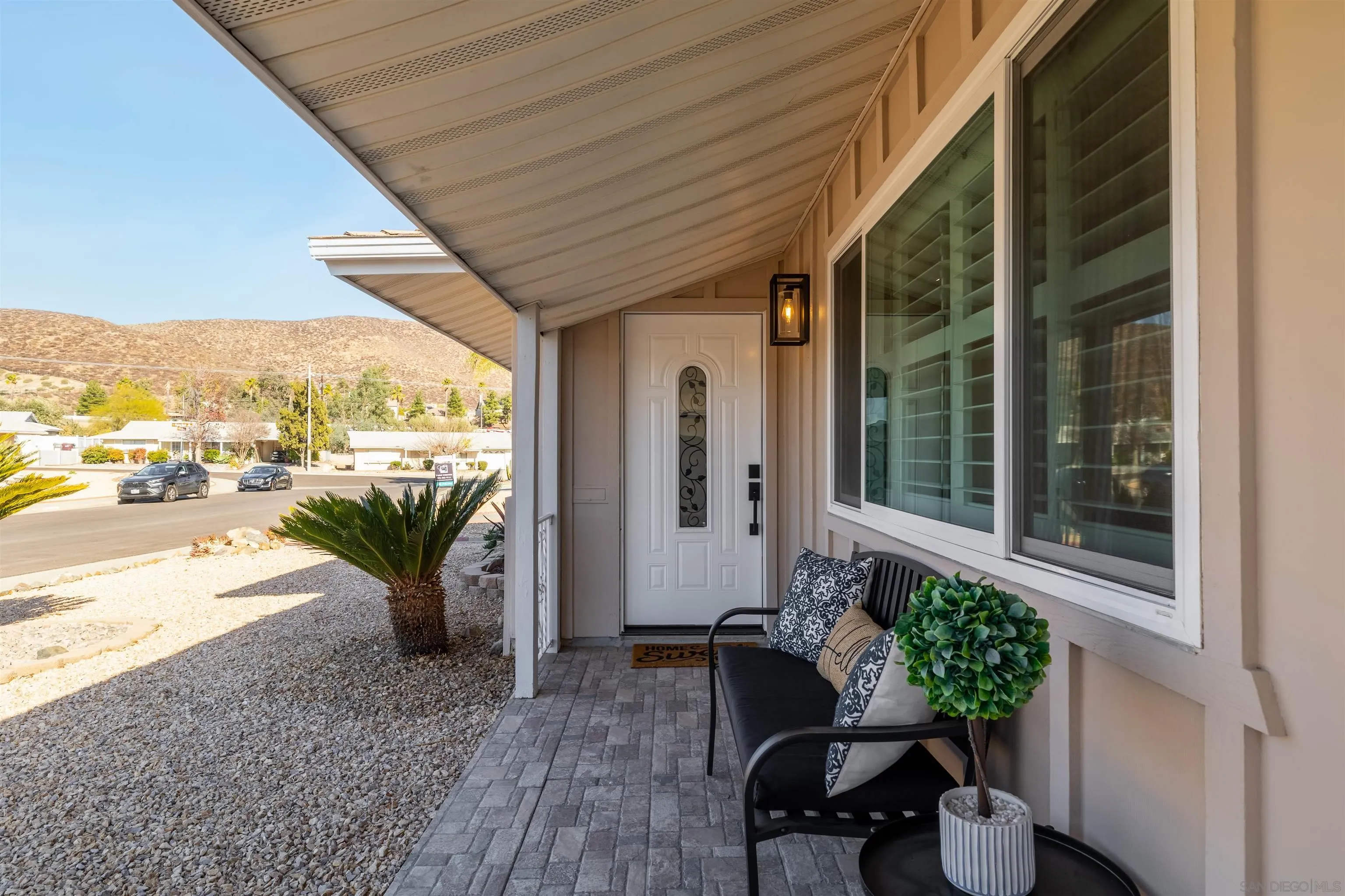 27431 El Rancho Road Menifee, CA 92586 - Photo 8 of 39 a house view with a seating space and garden view